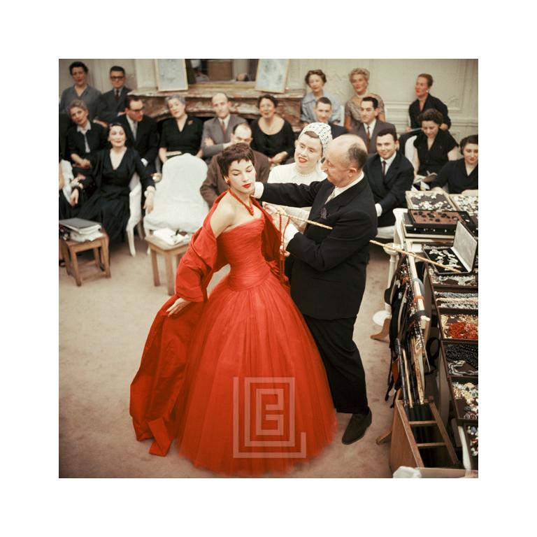 Mark Shaw Figurative Photograph - Salon Dior, Christian Dior and Marguerite Carre in Center Adjust Victoire, 1954