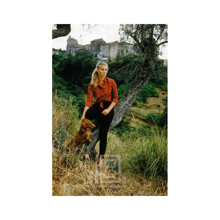 Mark Shaw Figurative Photograph - San Vittorino Socialite with Dachshund, 1957