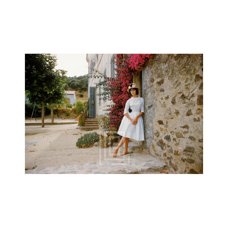 Mark Shaw Color Photograph - St. Tropez Model in White Eyelet Dress, 1961