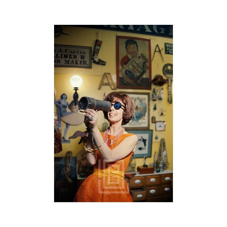 Mark Shaw Color Photograph – Tiger Morse in Orange, Antiques 01, New York, 1962