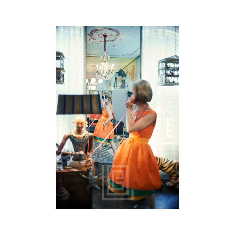 Mark Shaw Color Photograph - Tiger Morse in Orange on Phone 11, New York, 1962