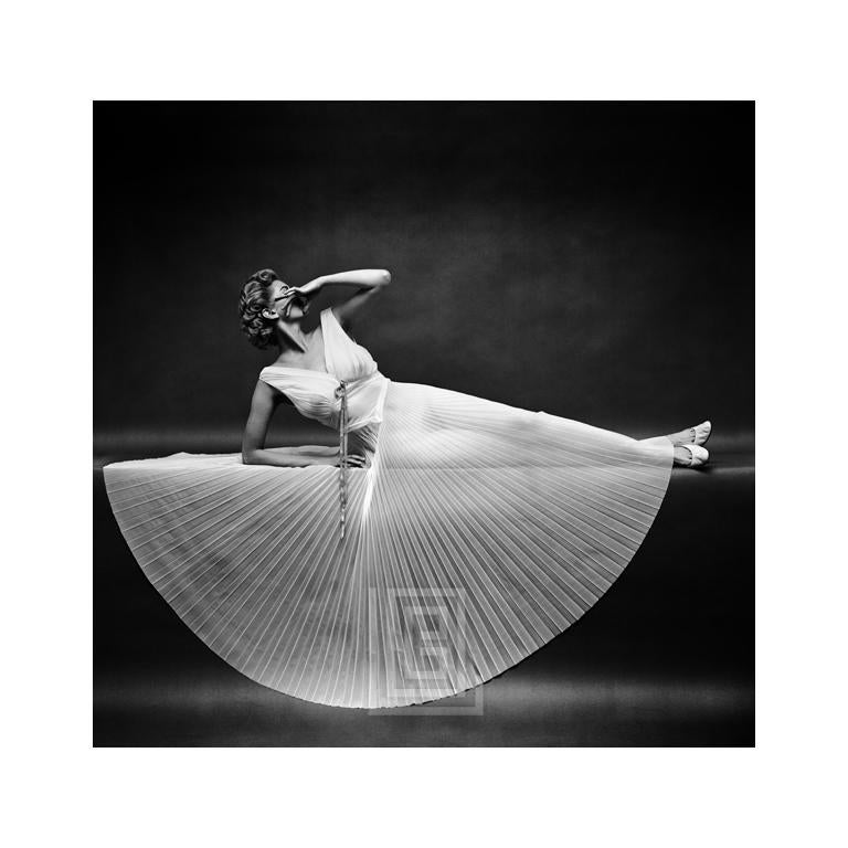 Mark Shaw Figurative Photograph - Vanity Fair Pleated Reclining Half Circle, Circa 1955