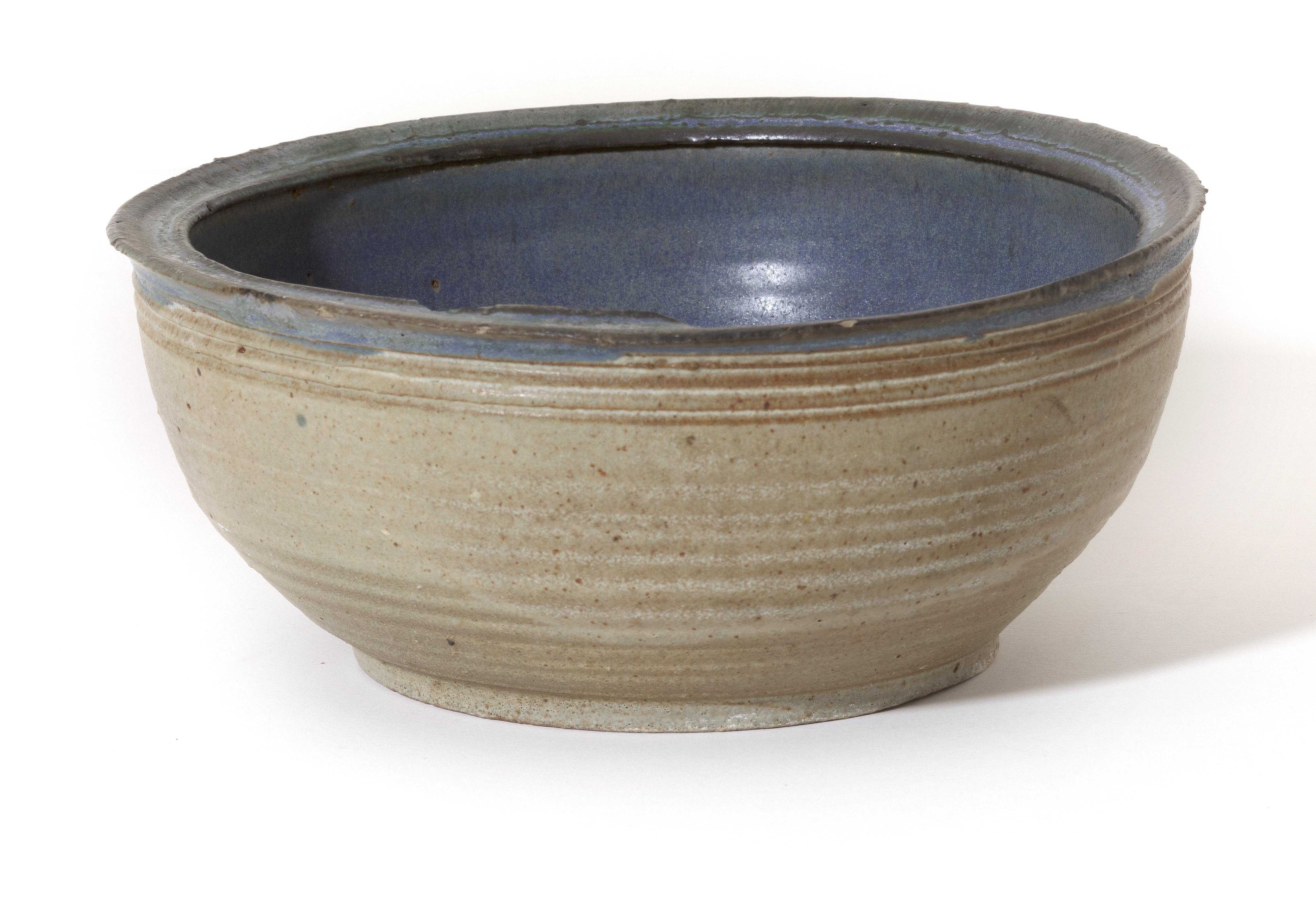 'Bowl (Blue & White)' is a hand-thrown glazed stoneware bowl made by Mark Shekore, signed with his last name on the bottom of the piece.

3.75 x 8.75 in

Mark Shekore attended the University of Wisconsin - Milwaukee, where he received his B.S.,