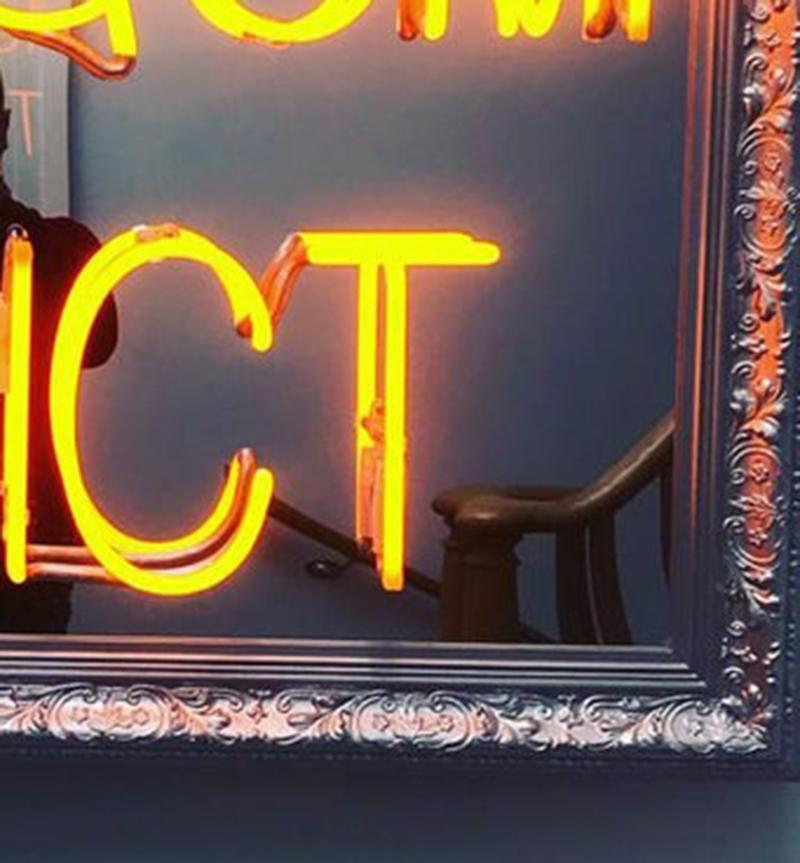 mirror with neon writing