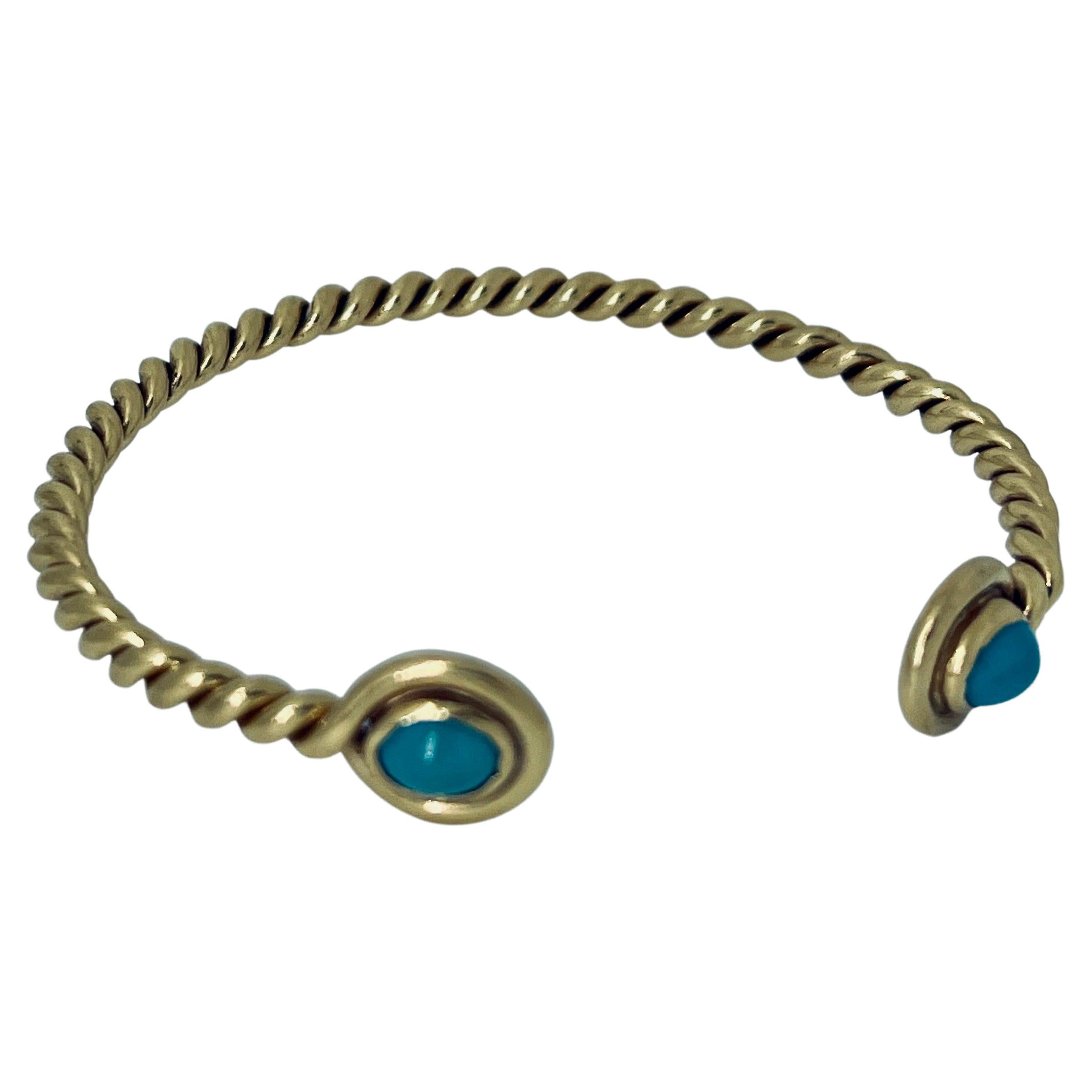 Bracelet jonc en or 18 carats et turquoise, 16 cm de circonférence, vers 1970 en vente