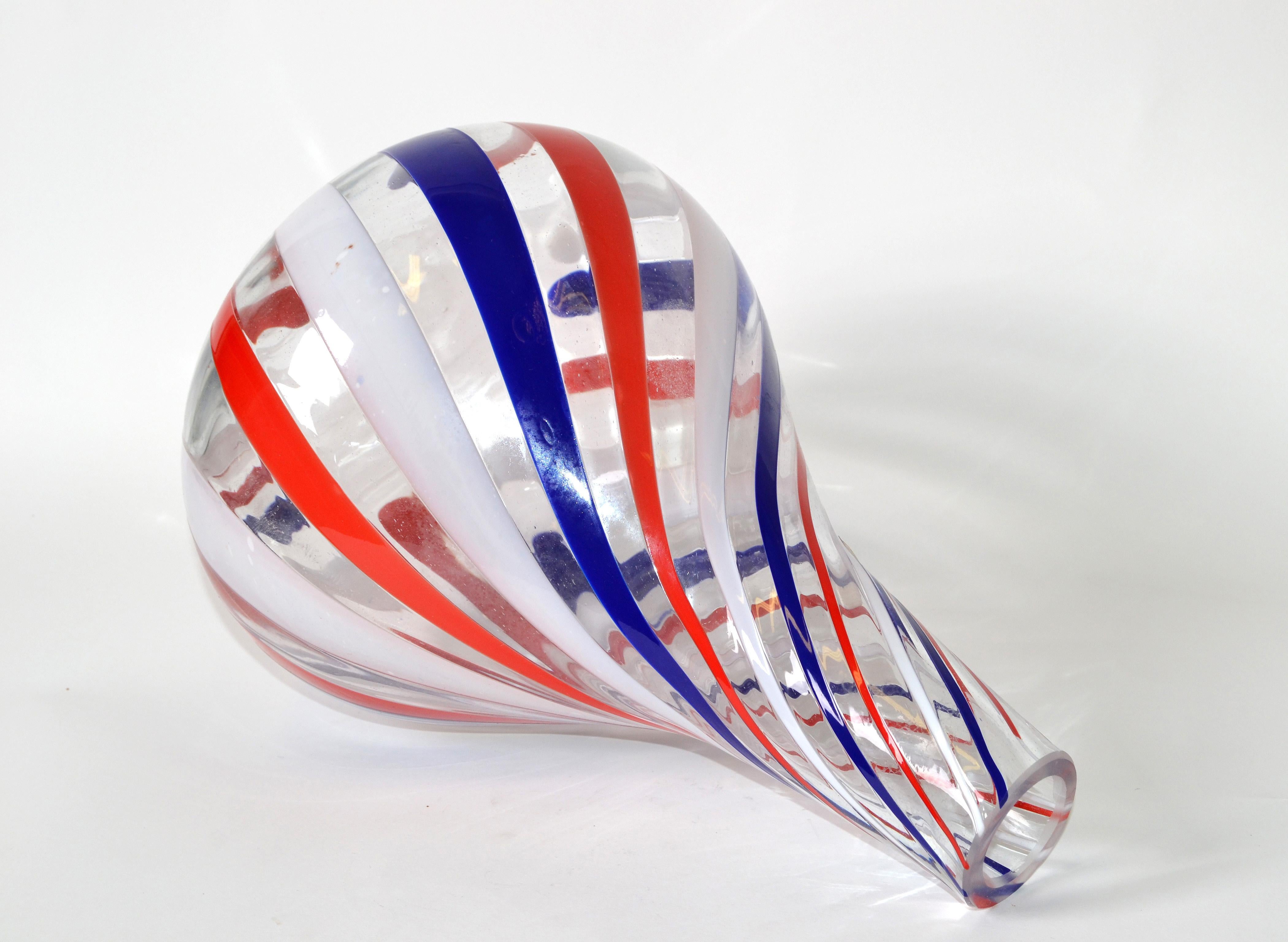Labeled Italian blown Murano vase in a candy swirl design motif of red, white, blue and clear coloring.
Marked with silver foil label.