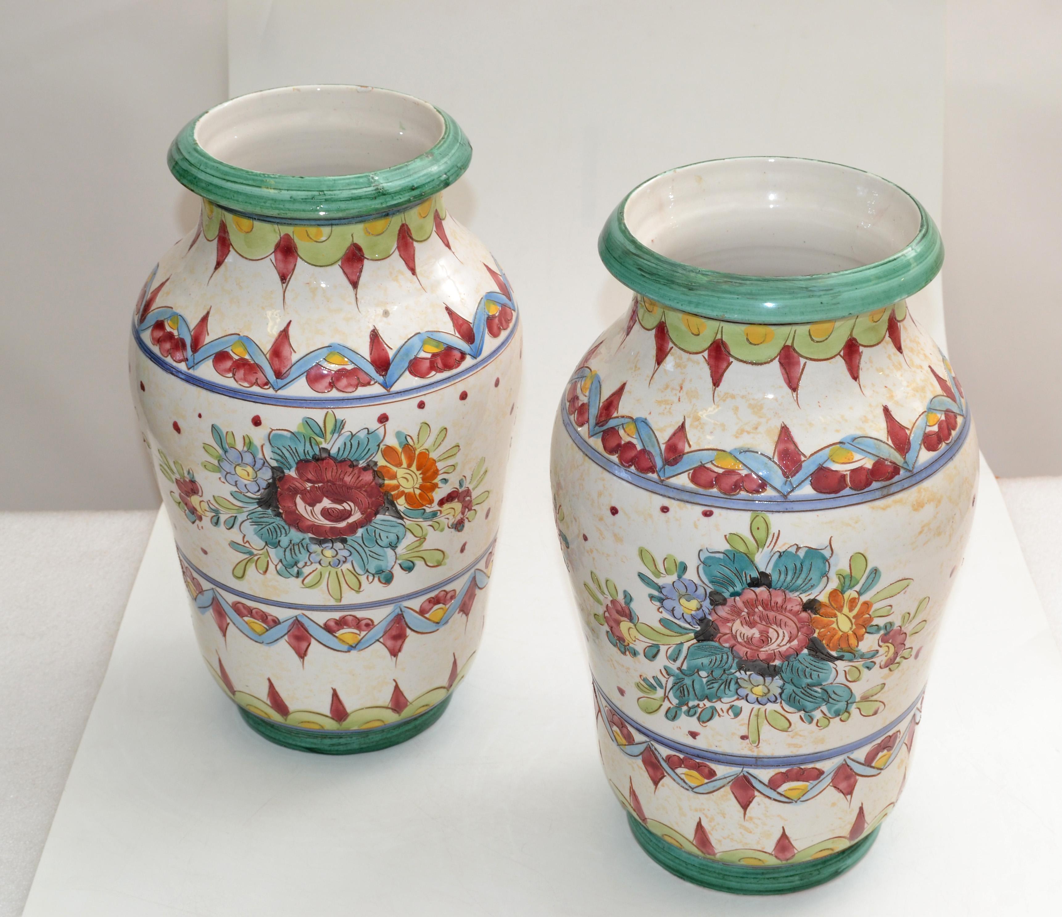 Set of 2 Italian handcrafted and hand painted Deruta style ceramic vases in white and mint foundation and bordeaux / blue flower motif.
The outside and inside is glazed.
The opening of the Vases are 5.75 inches & 6.5 inches.
Both are marked Italy