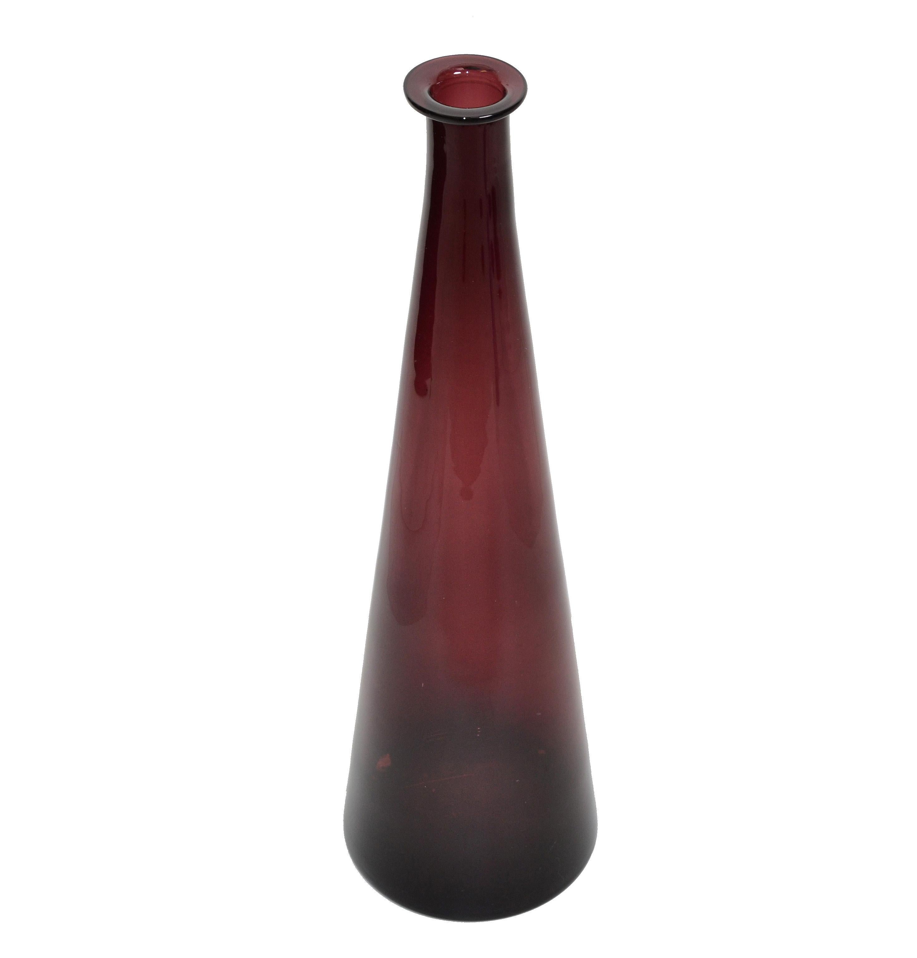 Italian Mid-Century Modern tall blown glass vase, vessel, decanter in translucent amethyst purple from Italy made in the late 1970s.
Amethyst purple is a shade that captivates the imagination and inspires.
Original Foil Label underneath.
This