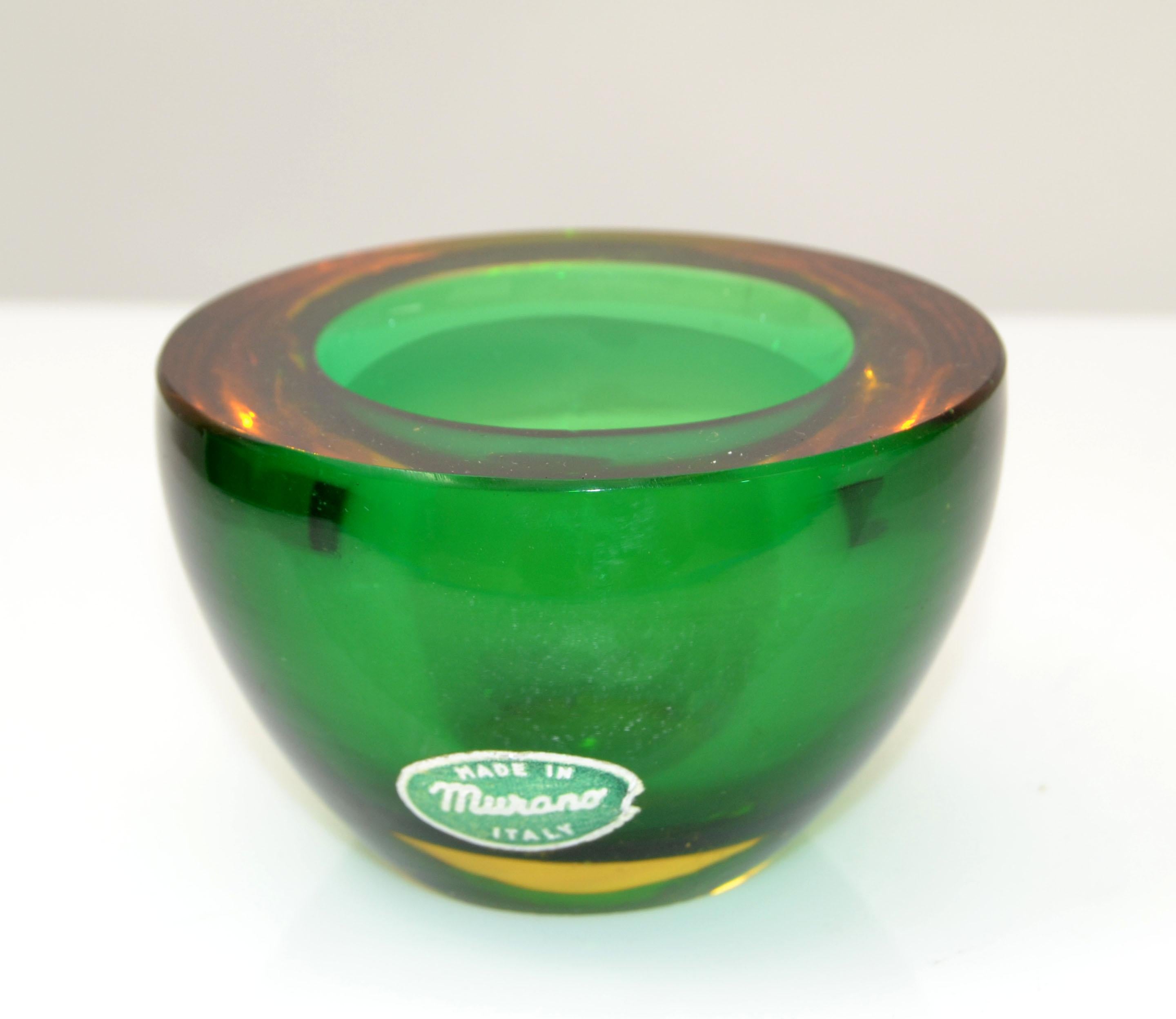 Mid-Century Modern Murano art glass bowl in amber and green, blown glass catchall, made in Italy.
Heavy glass bowl with outstanding details.
Foil Label at the Base.
