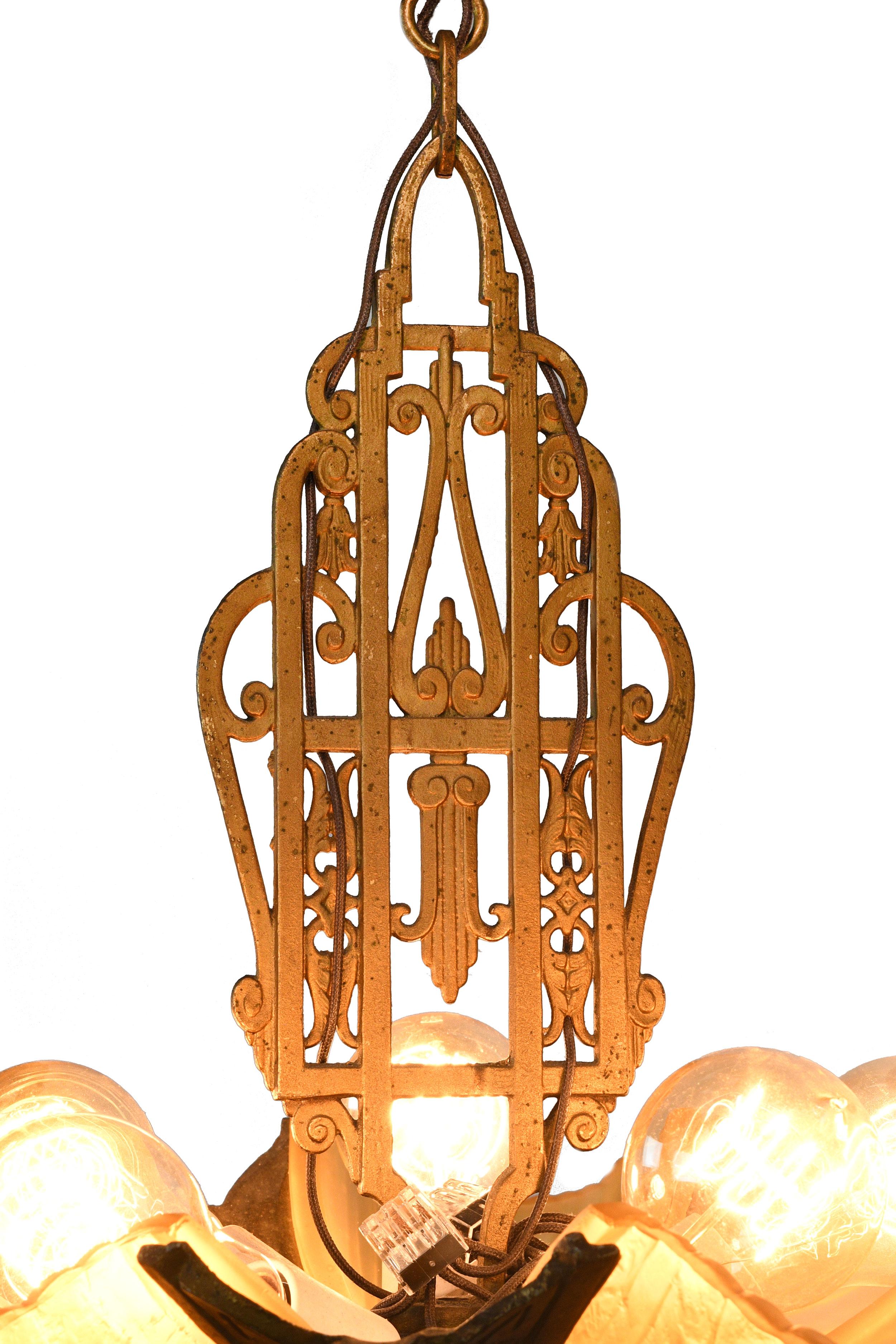 Incredible 5 light chandelier made by Markel Company, well known for their Art Deco and Art Nouveau slipper shade chandeliers and sconces. This fixture features an organic geometric latticework above the central body. Each of the shades is held in