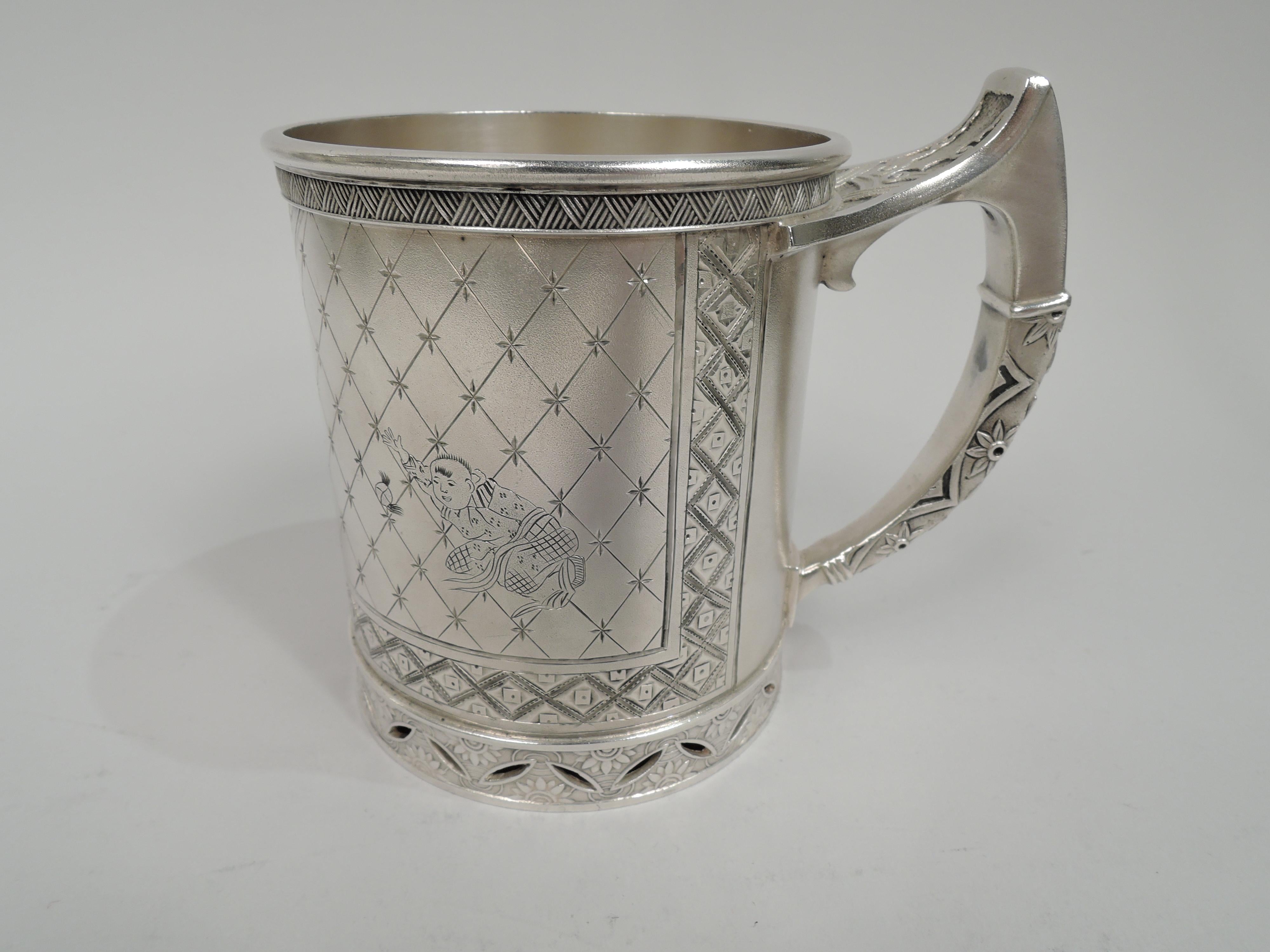 Market-fresh modish Japonesque sterling silver baby cup. Retailed by Tiffany & Co. in Union Square, New York. Straight sides and split-mounted high-looping. Butler-finish with kimono-clad, bristly-haired figures. One peeps from behind round