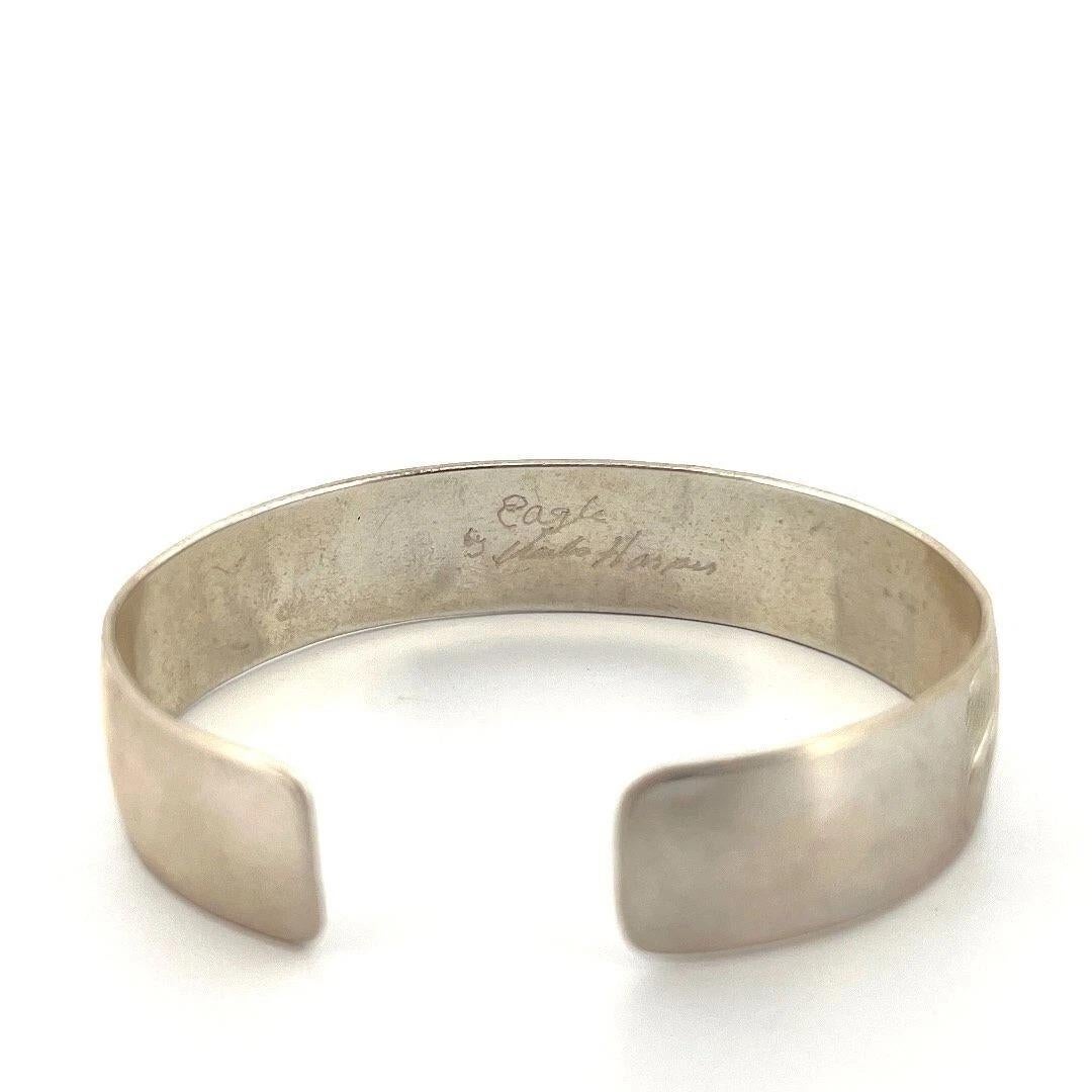 This hand-engraved sterling silver cuff bracelet is a striking example of Pacific Northwest Native artistry by renowned Haida artist Marko Harper. Titled 
