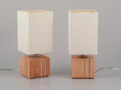 Markslöjd, Sweden. Pair of table lamps in light wood inlaid with steel.