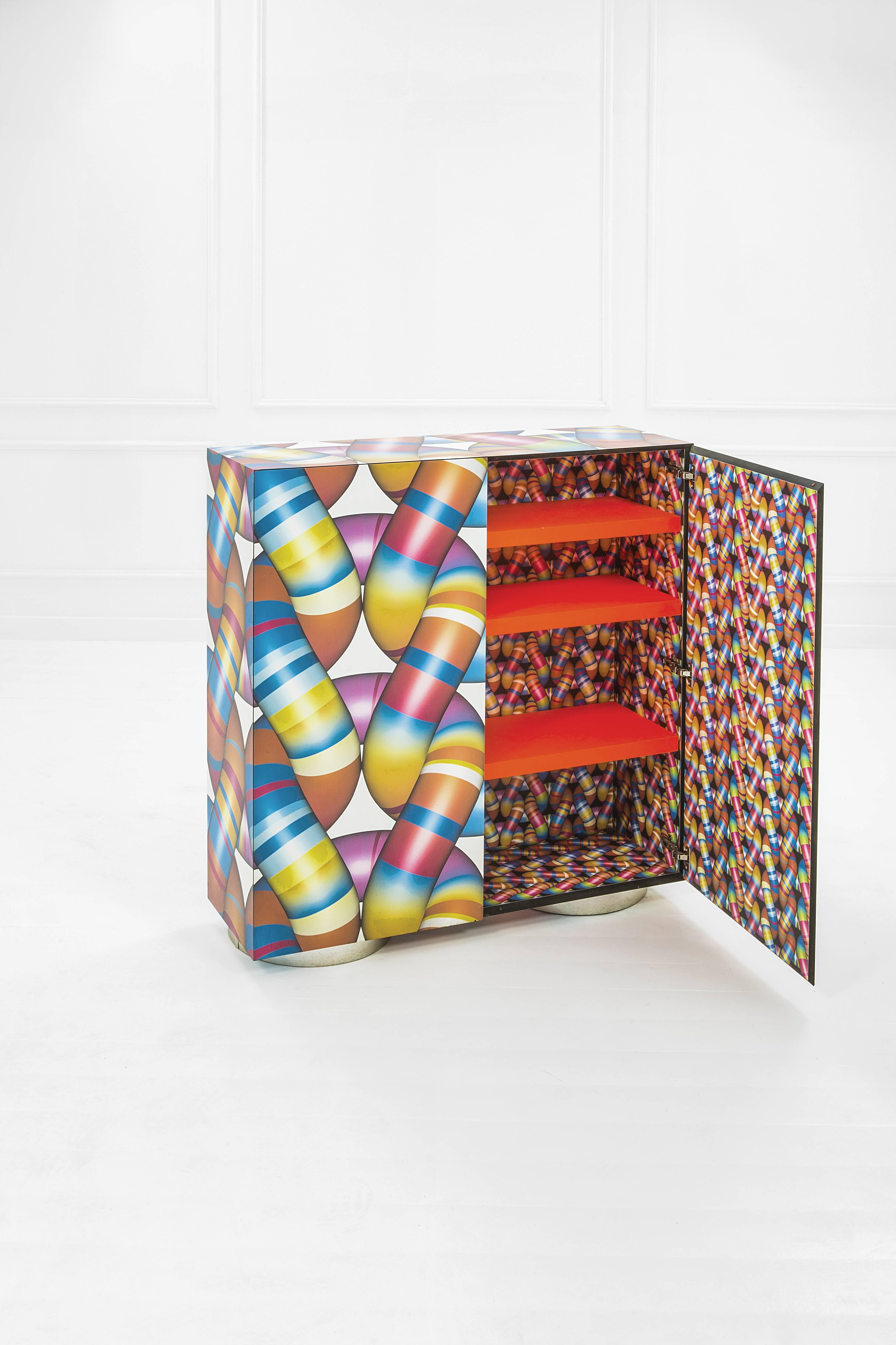 Markus Benesch (1961), sideboard of the La Casa Di Alice collection,
Laminated plastic and steel,
Limited edition of two copies,
Memphis manufacturer,
circa 2005, Italy.

Measures: Height 124 cm, width 118 cm, depth 36 cm.

Markus Benesch is a