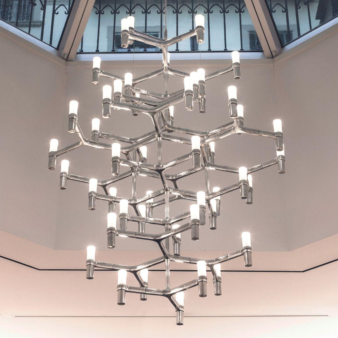 Markus Jehs & Jürgen Laub Crown Summa chandelier in polished aluminum for Nemo 

Expertly designed by Markus Jehs and Jürgen Laub this hand-polished pendant chandelier's form is inspired by the uniqueness & individuality of nature's snow crystal.