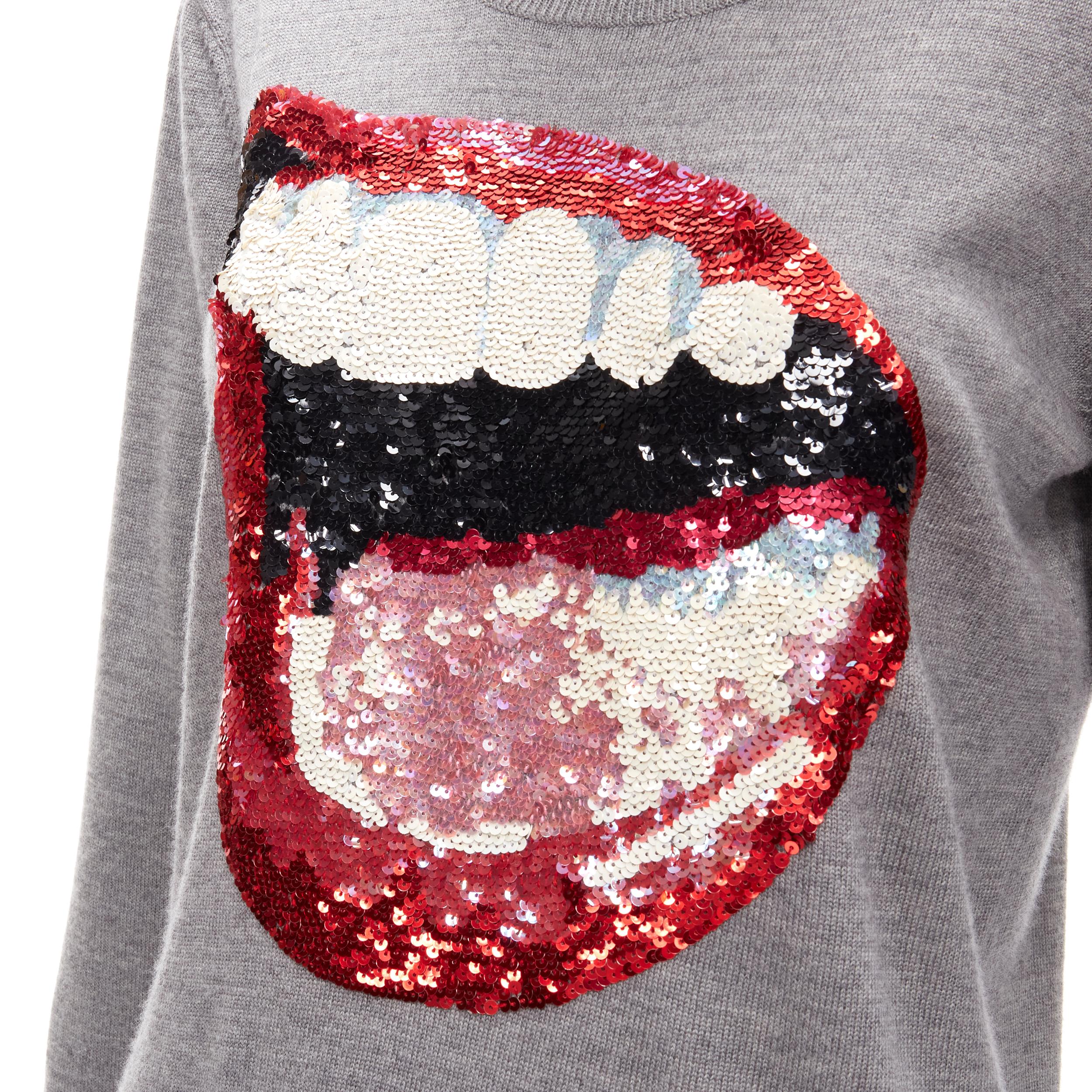 MARKUS LUPFER grey knit red lips sequins sweater S 
Reference: ANWU/A00717 
Brand: Markus Lupfer 
Material: Feels like cotton 
Color: Grey 
Pattern: Solid 


CONDITION: 
Condition: Excellent, this item was pre-owned and is in excellent condition.