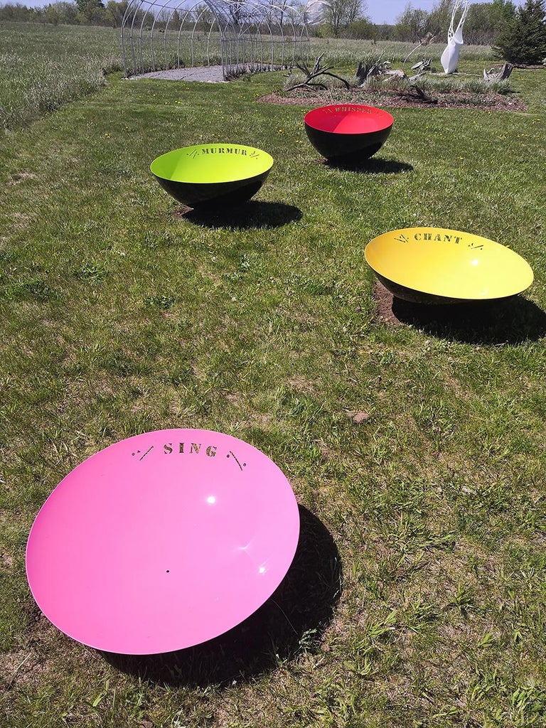 In this series of outdoor ‘singing’ bowl sculptures, Marlene Hilton Moore continues to explore the theme of ‘listening.’ This stainless-steel bowl is laser cut with the word “Sing” in a stencil font and coated in bright pink and black paint. 

“Do