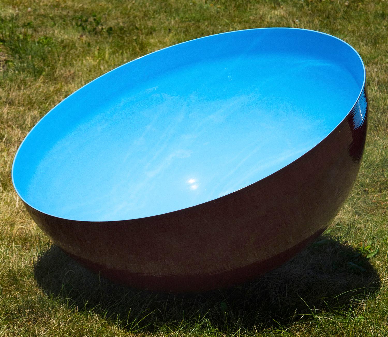 Based on Tibetan singing bowls, a medium sized outdoor stainless steel bowl is coated in a rich cerulean blue by sculptor Marlene Hilton Moore. This sculpture can be installed indoor or outdoor and may be paired with another, larger Cerulean sky