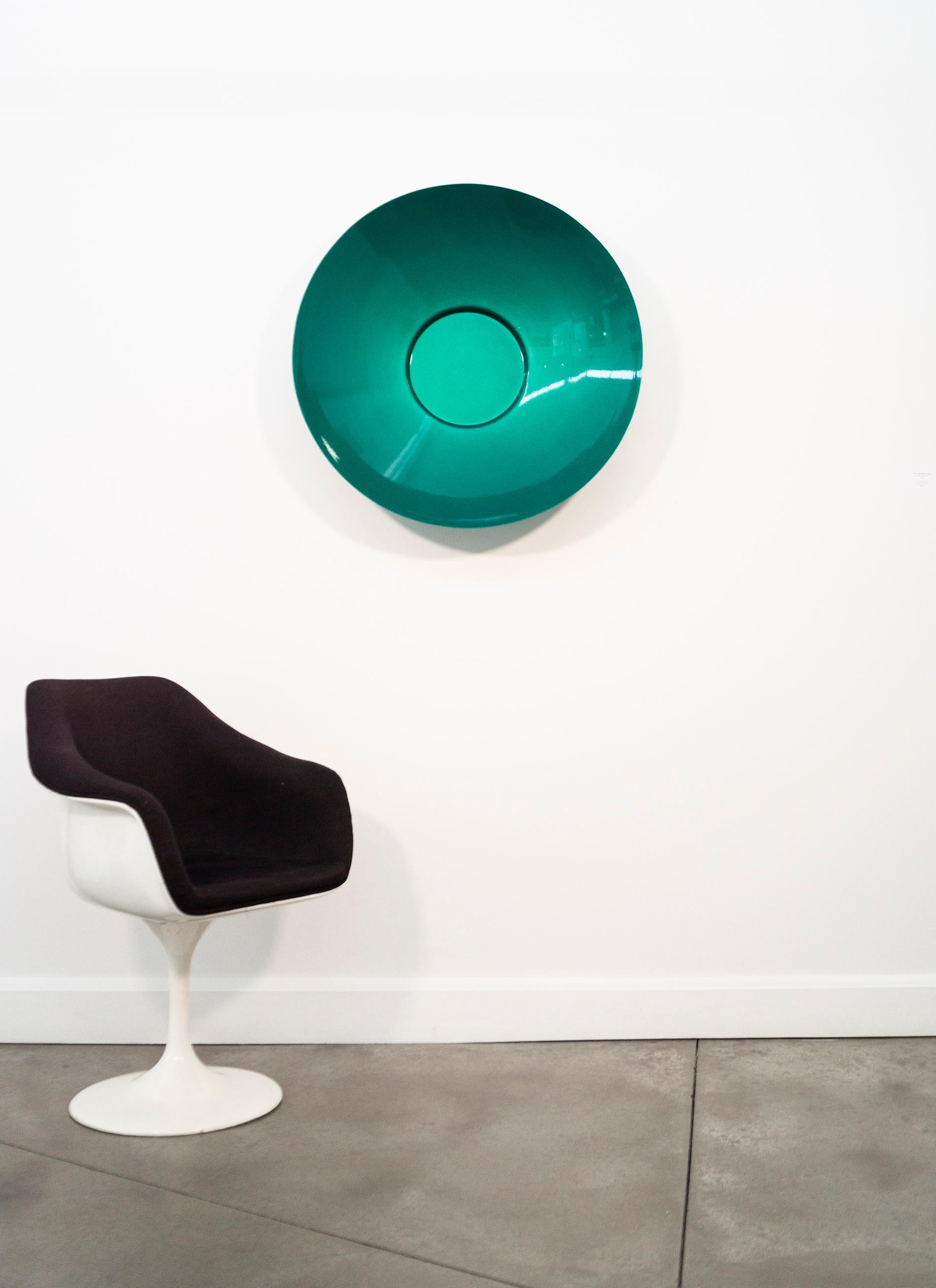 Inspired by ancient vessels, Marlene Hilton Moore’s colourful, contemporary wall sculptures are made from polished powder-coated steel. The deep blue-green colour of the vessel draws the viewer’s eye to its perfect and pleasing circular form. The