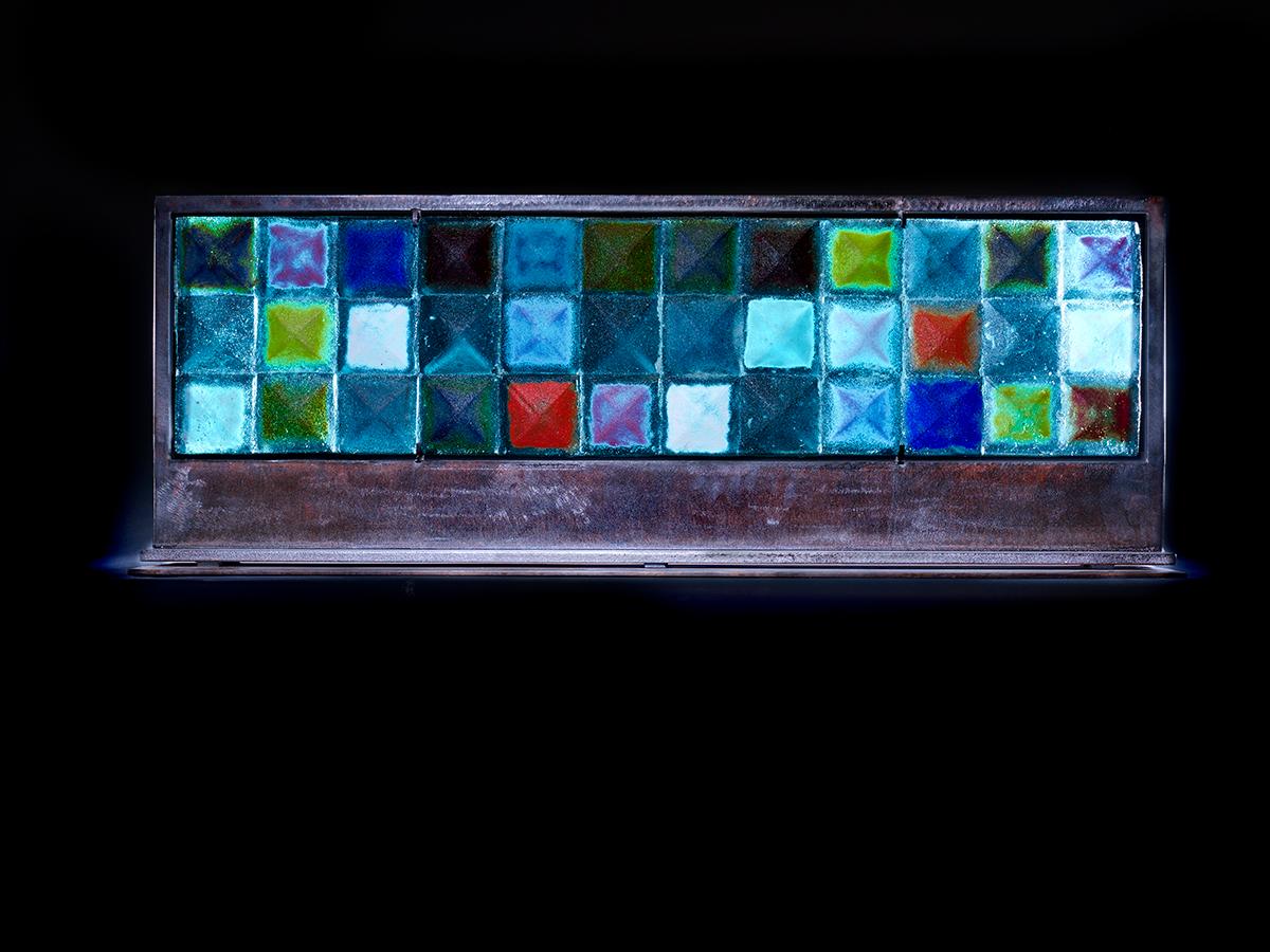 Marlene Rose Figurative Sculpture - "Aqua Horizontal Pyramid Quilt, " sand cast glass sculpture, forged metal base