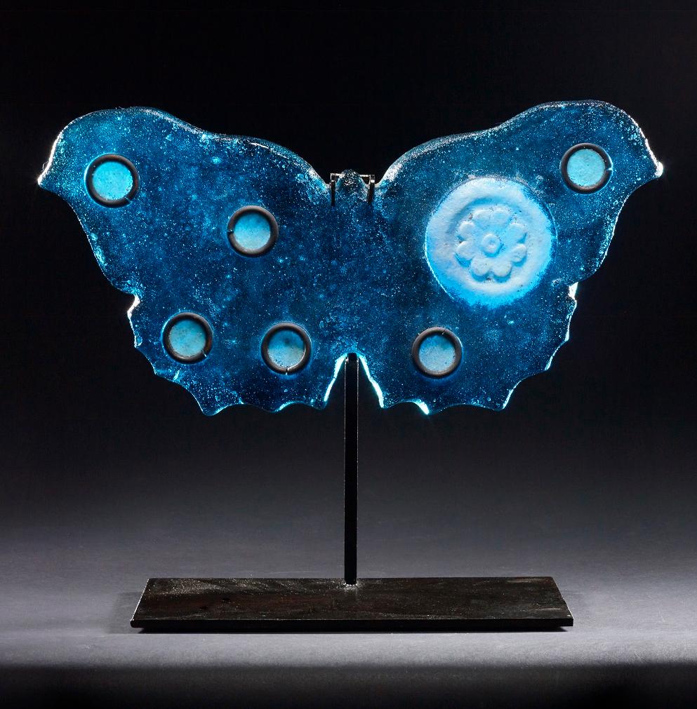 Marlene Rose Figurative Sculpture - "Blue Butterfly, " Pigmented sand-cast glass sculpture, hand forged metal base