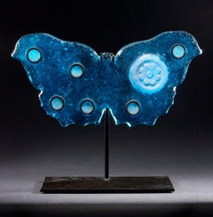 "Blue Butterfly, " Pigmented sand-cast glass sculpture, hand forged metal base