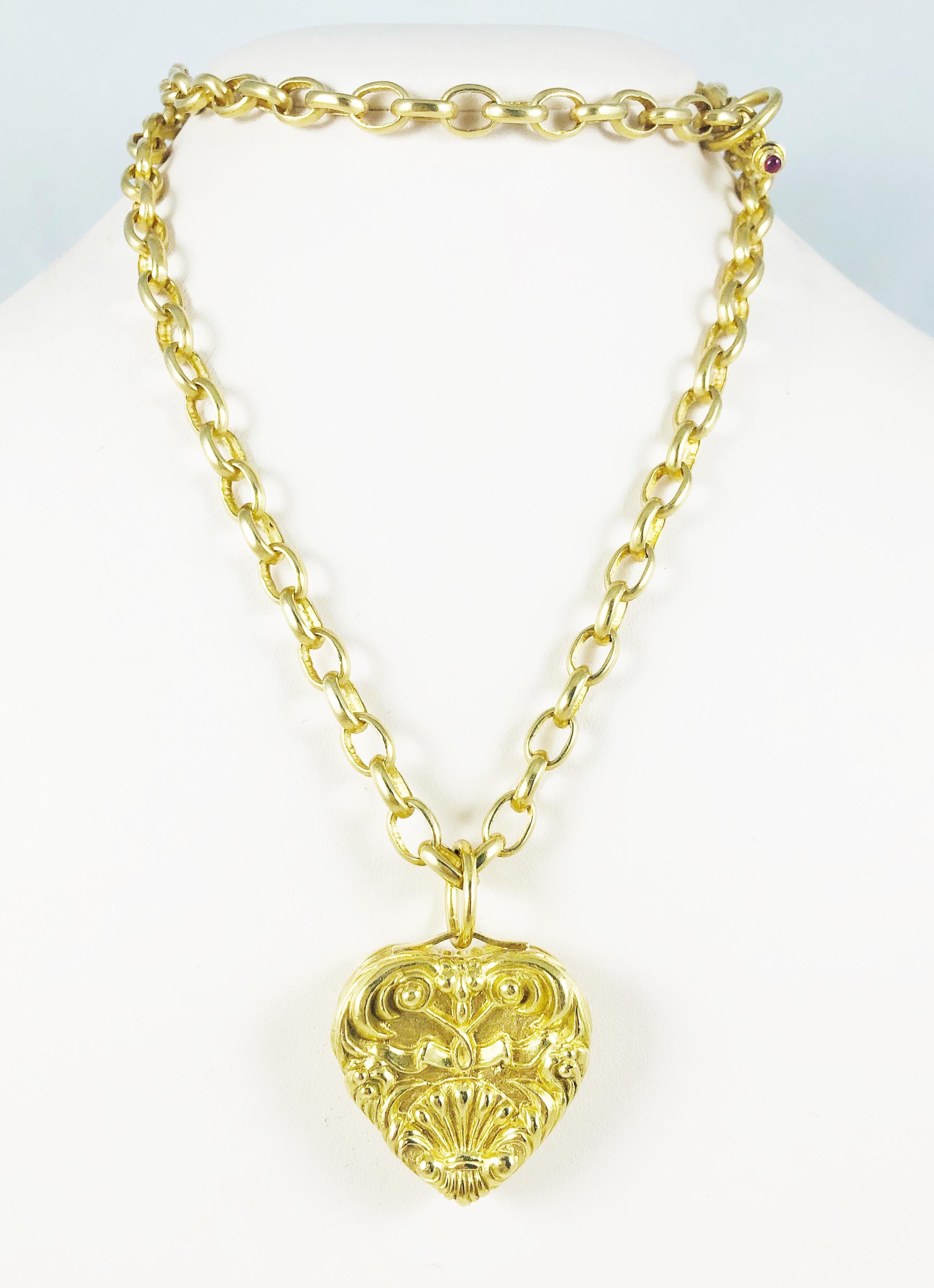 This is a gorgeous designer Marlene Stowe Piece! Made in 18 K Yellow Gold, this piece features a beautifully carved heart Pendant that measures 1.5 inches by 1.25 inches. The heart is removable so this piece can be worn in four ways!: A single, 30