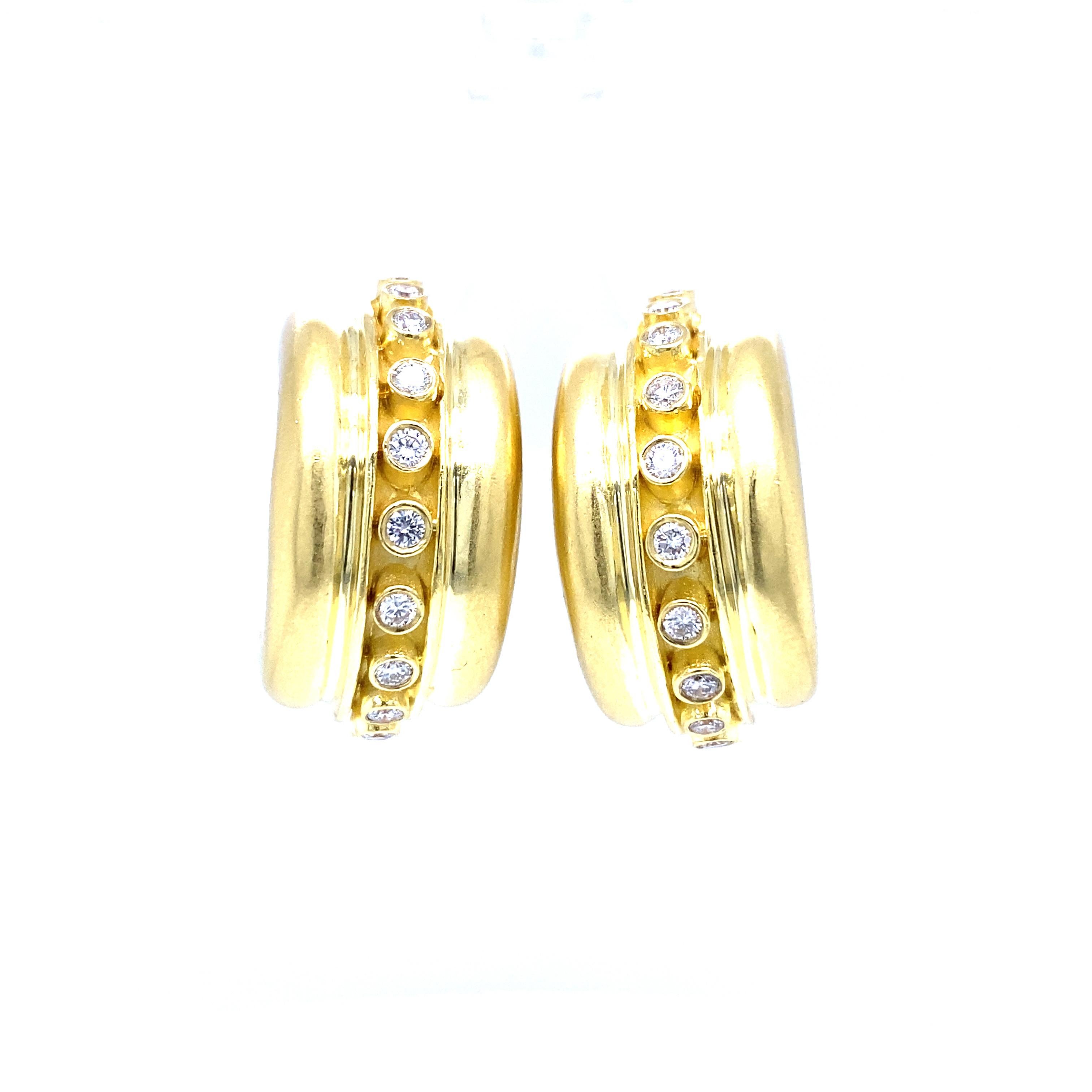 Marlene Stowe Bezel Diamond Hoop Earrings in 18K Yellow Gold.  (22) Round Brilliant Cut Diamonds weighing 0.88 carat total weight, G-H in color and VS in clarity are expertly set.  The Earrings measure 1 inch in length and 1/2 inch in width.  26.22