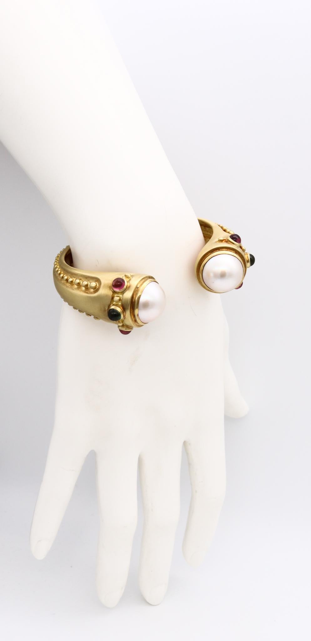 A jeweled cuff bracelet designed by Marlene Stowe.

Very handsome and colorful Etruscan Revival piece, crafted in New York city in solid 18 karats yellow gold with rich brushed finish. Is suited with a tension secure lock system.

Mounted with a