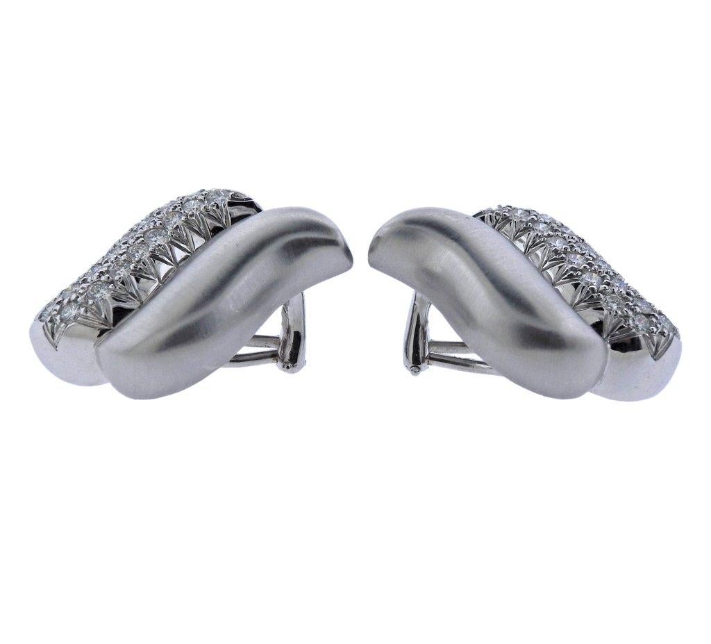 Pair of 18k white gold earrings, crafted by Marlene Stowe, decorated with approx. 1.30ctw in G/VS diamonds.  Earrings are 29mm x 18mm, Weight 26.2 grams. Marked: M. Stowe, 18k.