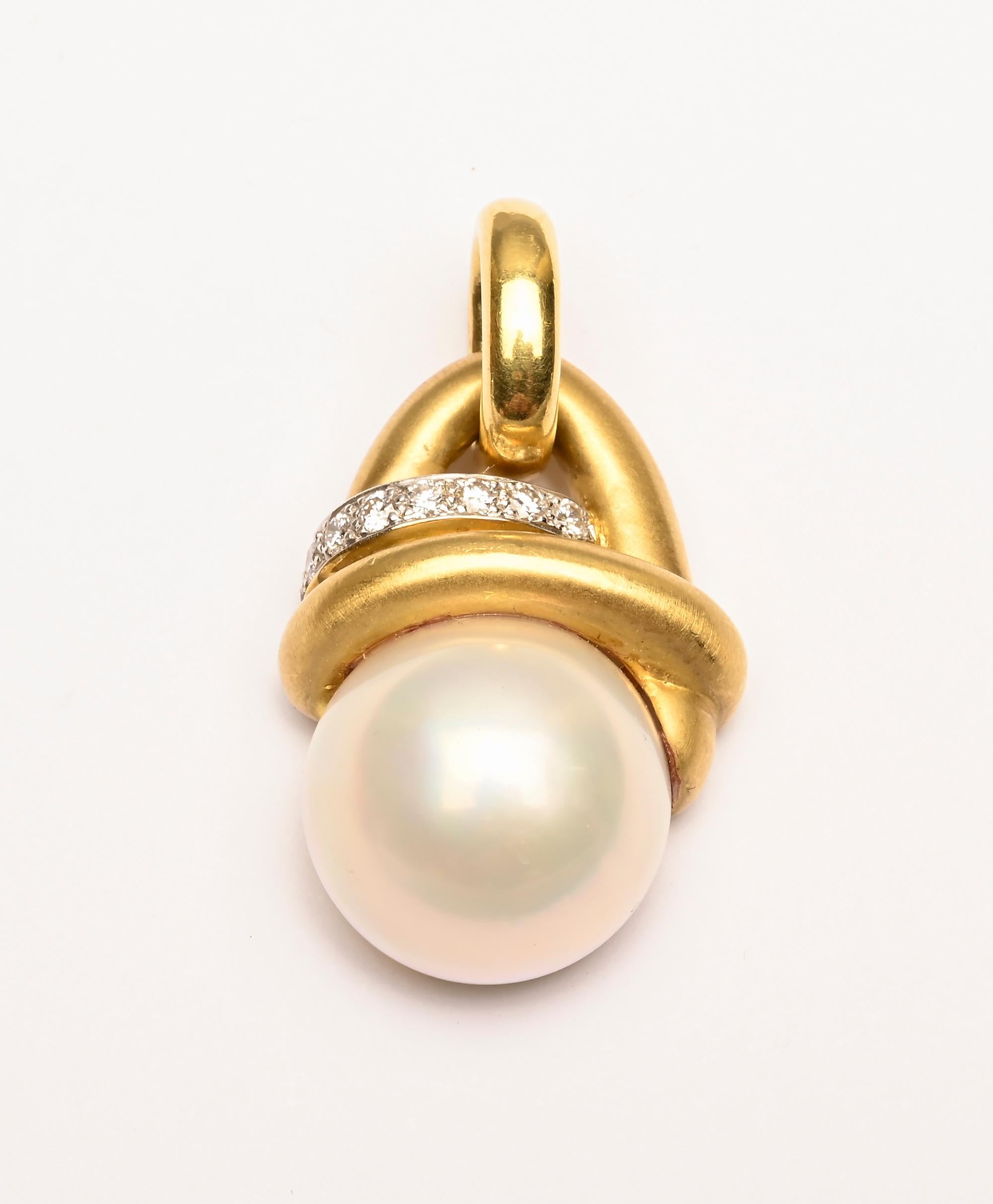 Marlene Stowe pearl pendant with 7 diamonds weighing approximately .3 karats. The half pearl measures 7/8