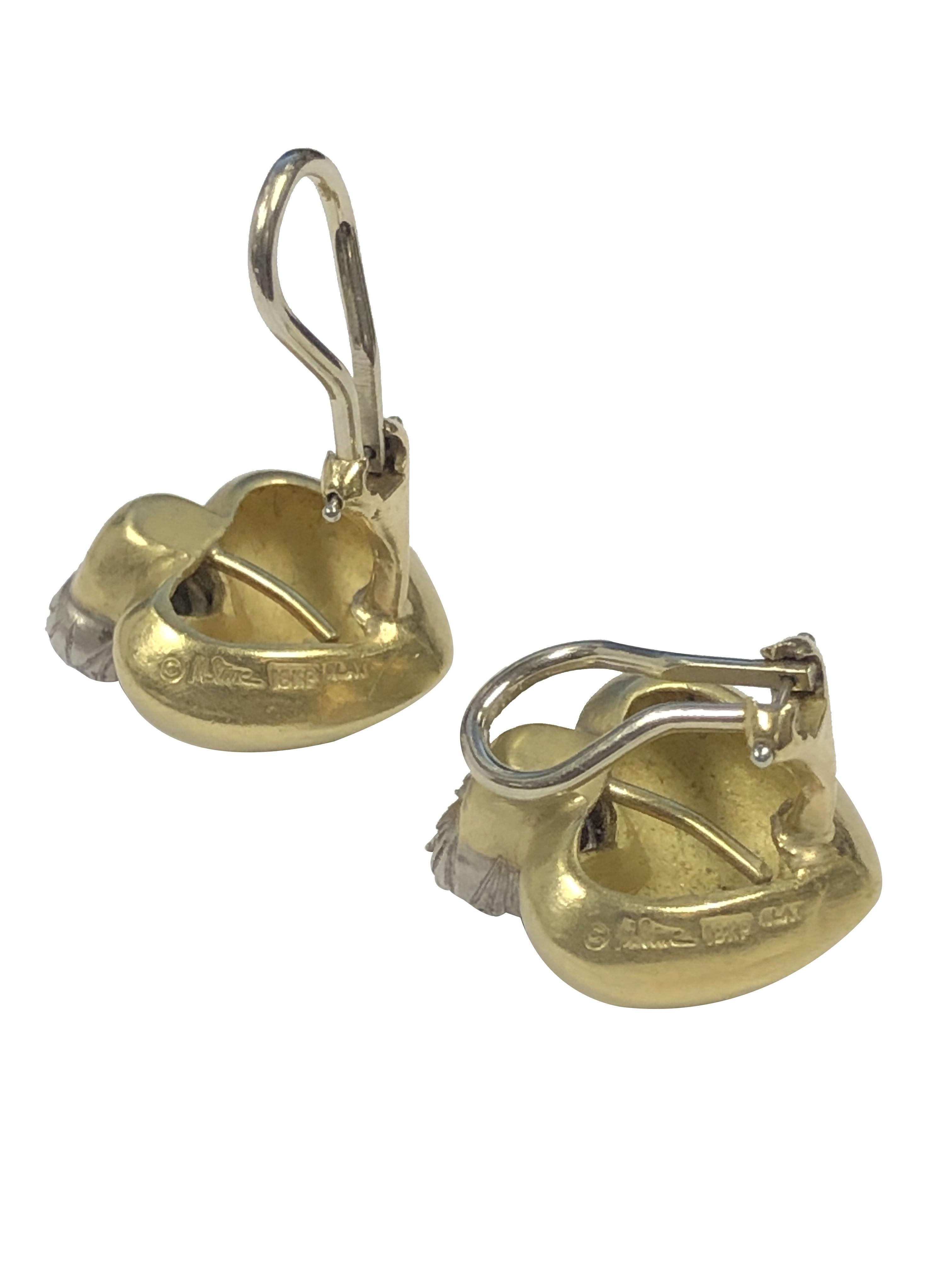 Circa 2000 Marlene Stowe 18k Yellow Gold and Platinum Heart Shaped Earrings, measuring 3/4 inch in length 5/8 inch wide and weighing 17.3 Grams, set with Round Brilliant cut Diamonds totaling 1.50 Carats. having a Light Brushed or Frosted finish,