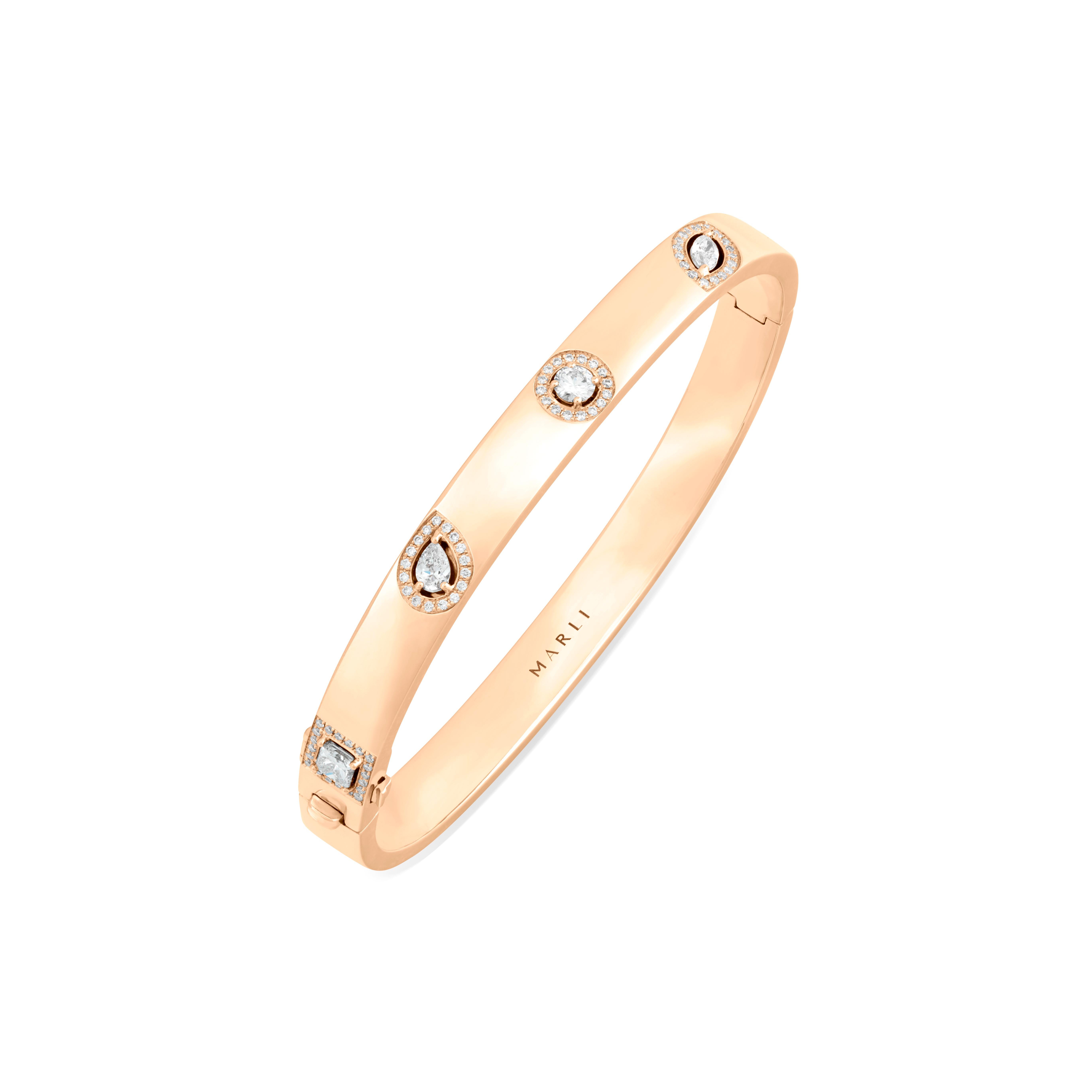 Sugar crystallized onto a string, like candy an assortment of  diamonds in various shapes. Vintage gems re-imagined as  sassy luxury treats.
Relish the remarkable flavor of wonder. The sweet and sassy Rock Hinged Bangle is available in 18K white,
