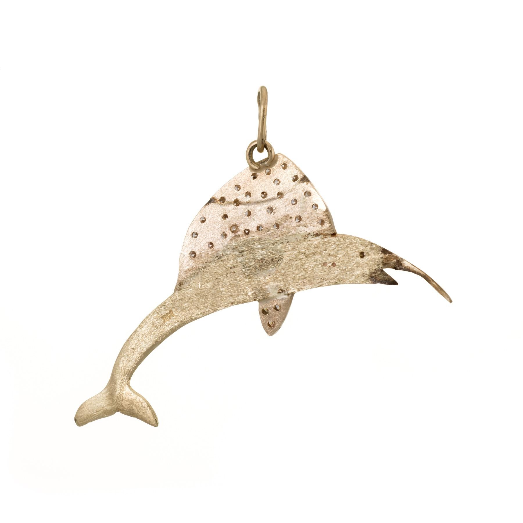 Finely detailed marlin fish pendant, crafted in 14k yellow gold. 

31 round brilliant cut diamonds are pave set into the pendant and total an estimated 0.31 carats (estimated at H-I color and VS2-SI1 estimated).  

The pendant is in excellent