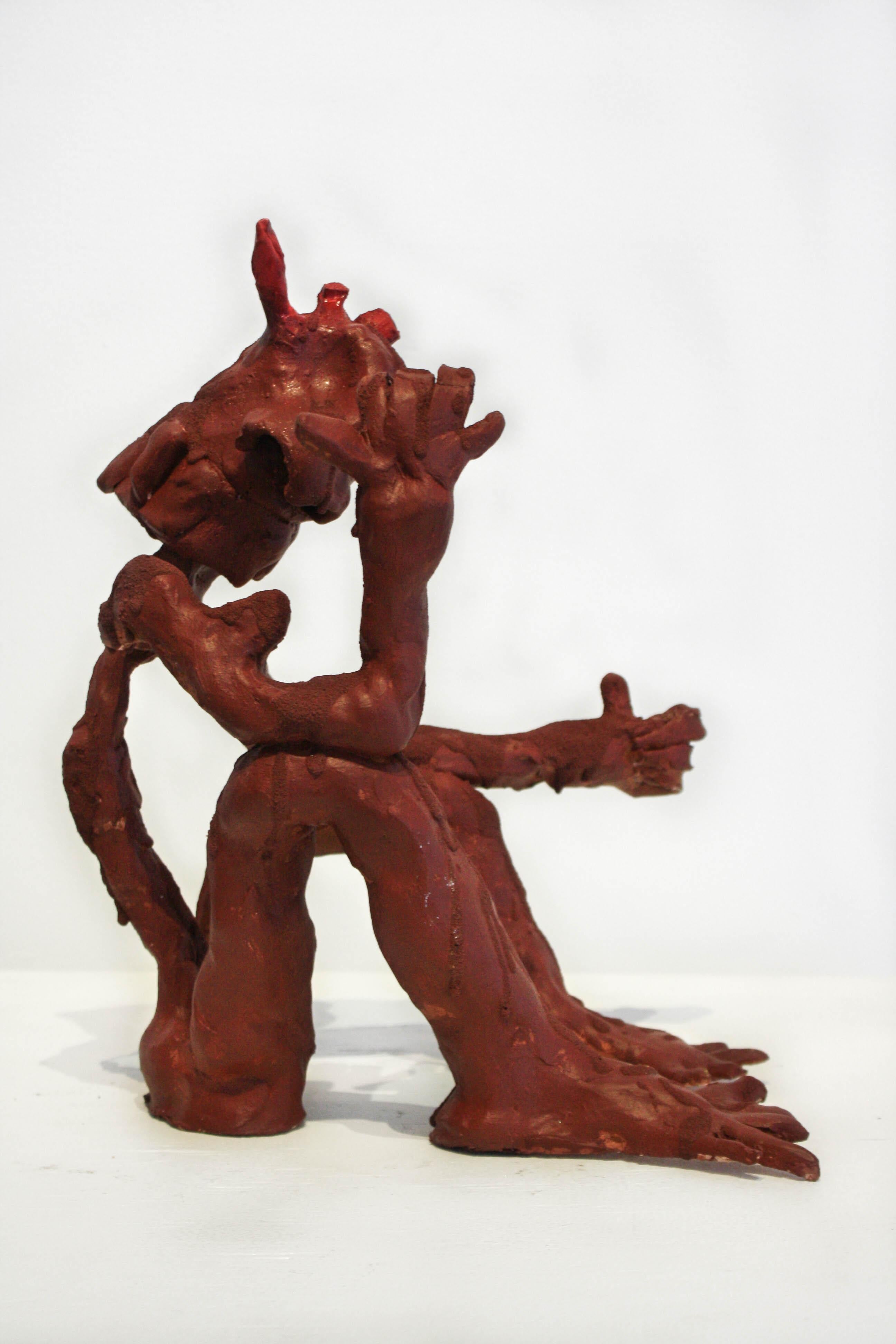 This small figurative sculpture is in a deep brown color. 

Nashville based artist, Marlos E��’van received their BFA from Watkins College of Art,Design, and Film in 2016. From street art to canvases; from performance art to film-making, E’van
