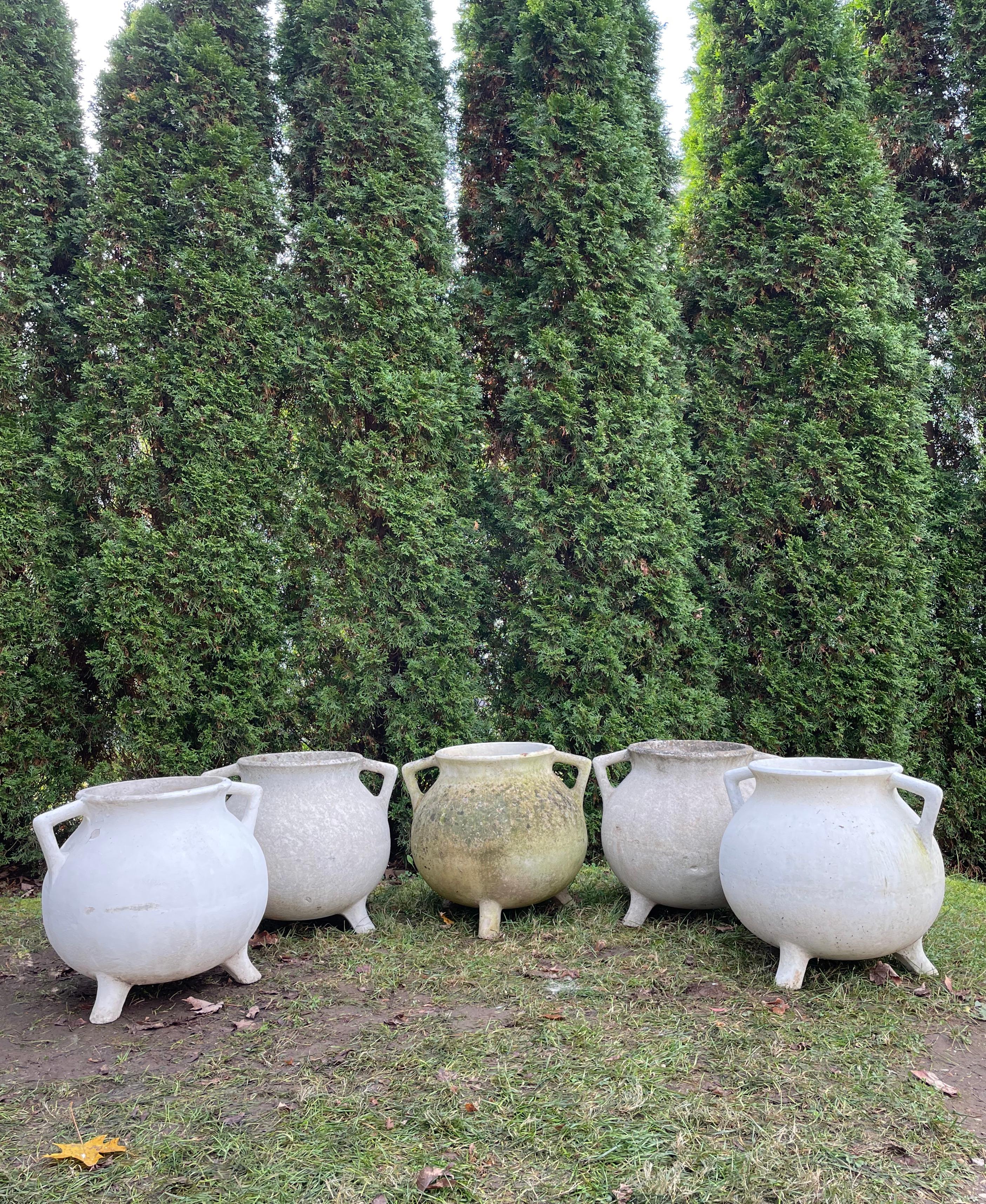 We are huge fans of Willy Guhl garden pieces and have three “Marmite” planters with two different patinas available. Two have a lightly patinated natural surface (#2 and #4 from left), while one has been painted white in the not-too-distant past.