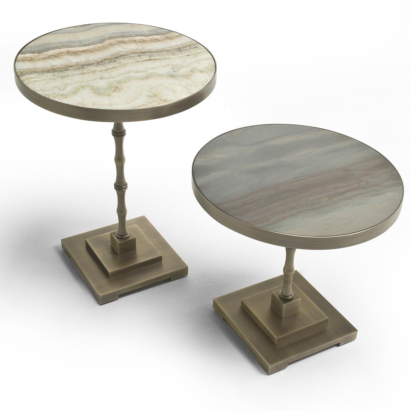 Marble take center stage in this original side table by Fratelli Boffi. The shorter of the two in the Marmora Collection, this side table features a brushed marble top. The table is completed by a stacked square base and a bamboo-inspired stem. Pair