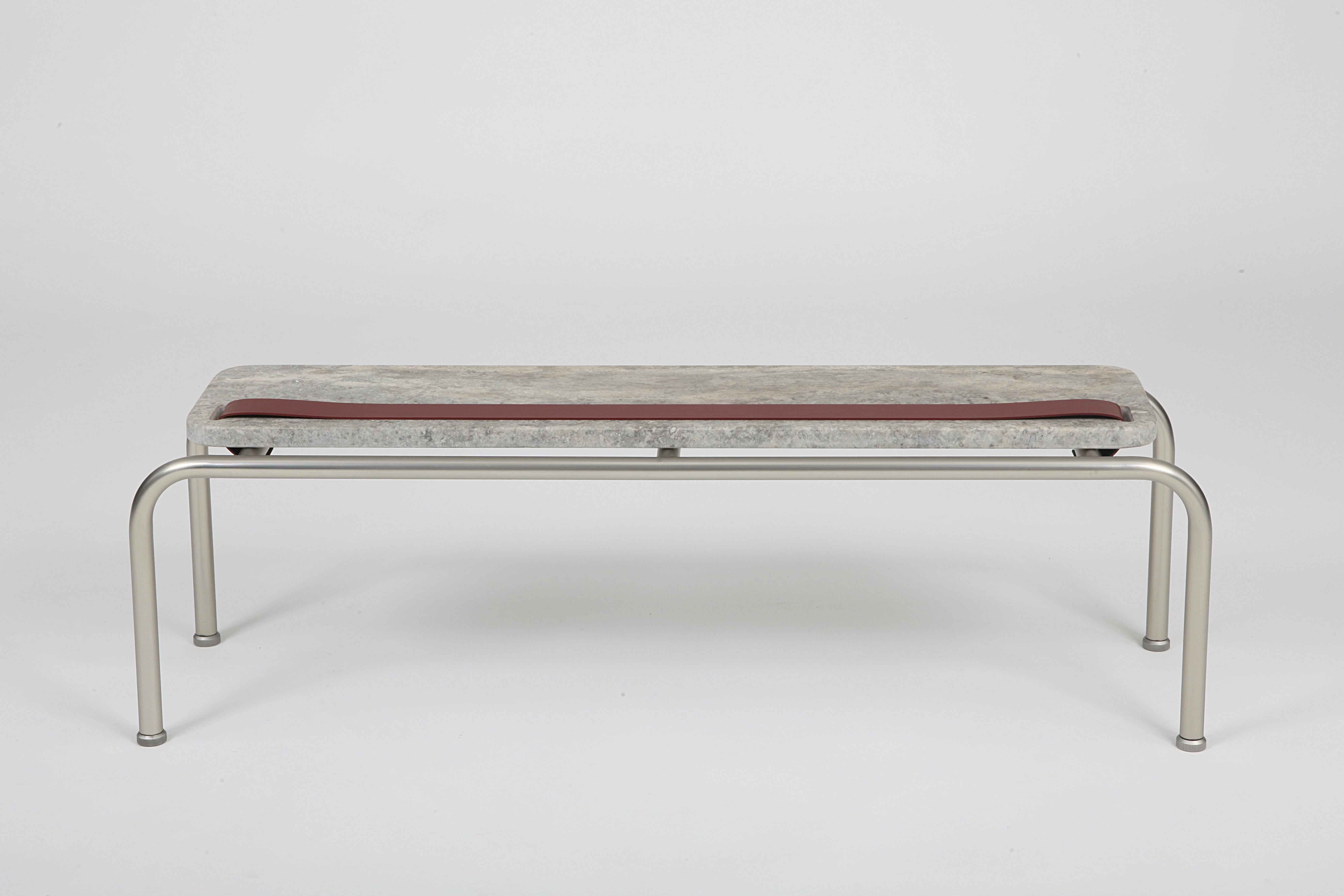 Marmorino plays with polar opposites of soft and hard materials that create contrasts and combinations of shades. The leather band that intersects the marble can be used to hold everyday objects. The coffee table is available in two widths.

Metal: