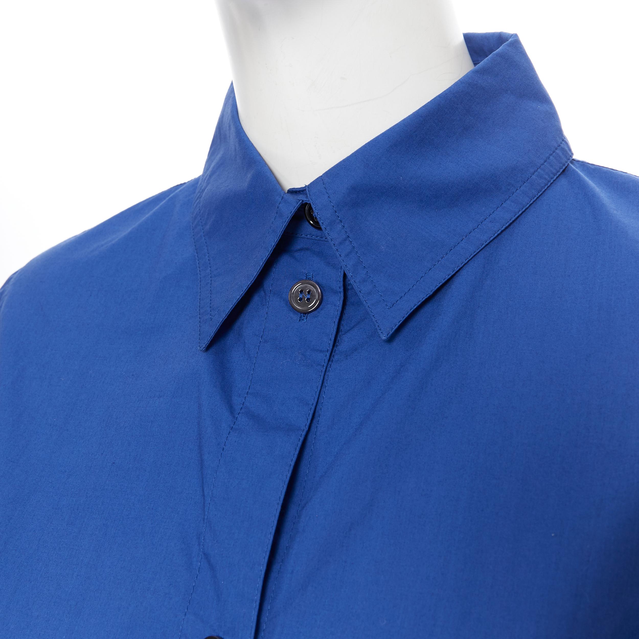 MARNI 100% cotton cases 3/4 sleeves step hem cotton shirt top IT38
Brand: Marni
Model Name / Style: Cotton top
Material: Cotton
Color: Blue
Pattern: Solid
Closure: Button
Extra Detail: 3/4 sleeve. High low step hem.
Made in: Italy

CONDITION: