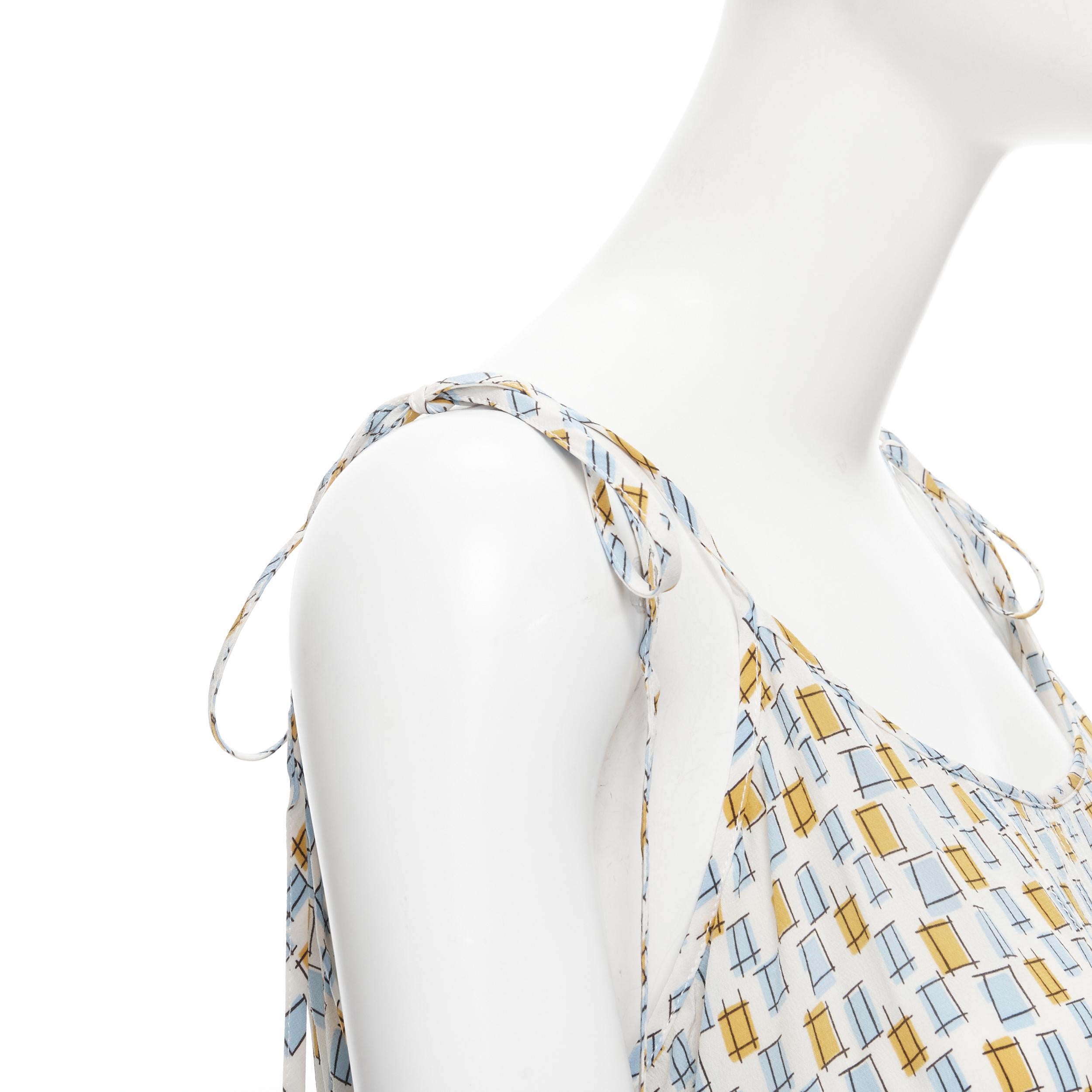 MARNI 100% silk yellow blue scribble print overstitch cami slip dress IT38 XS 
Reference: CELG/A00186 
Brand: Marni 
Material: Silk 
Color: Yellow 
Pattern: Geometric 
Closure: Tie 
Extra Detail: White overstitching on silk. 
Made in: Italy