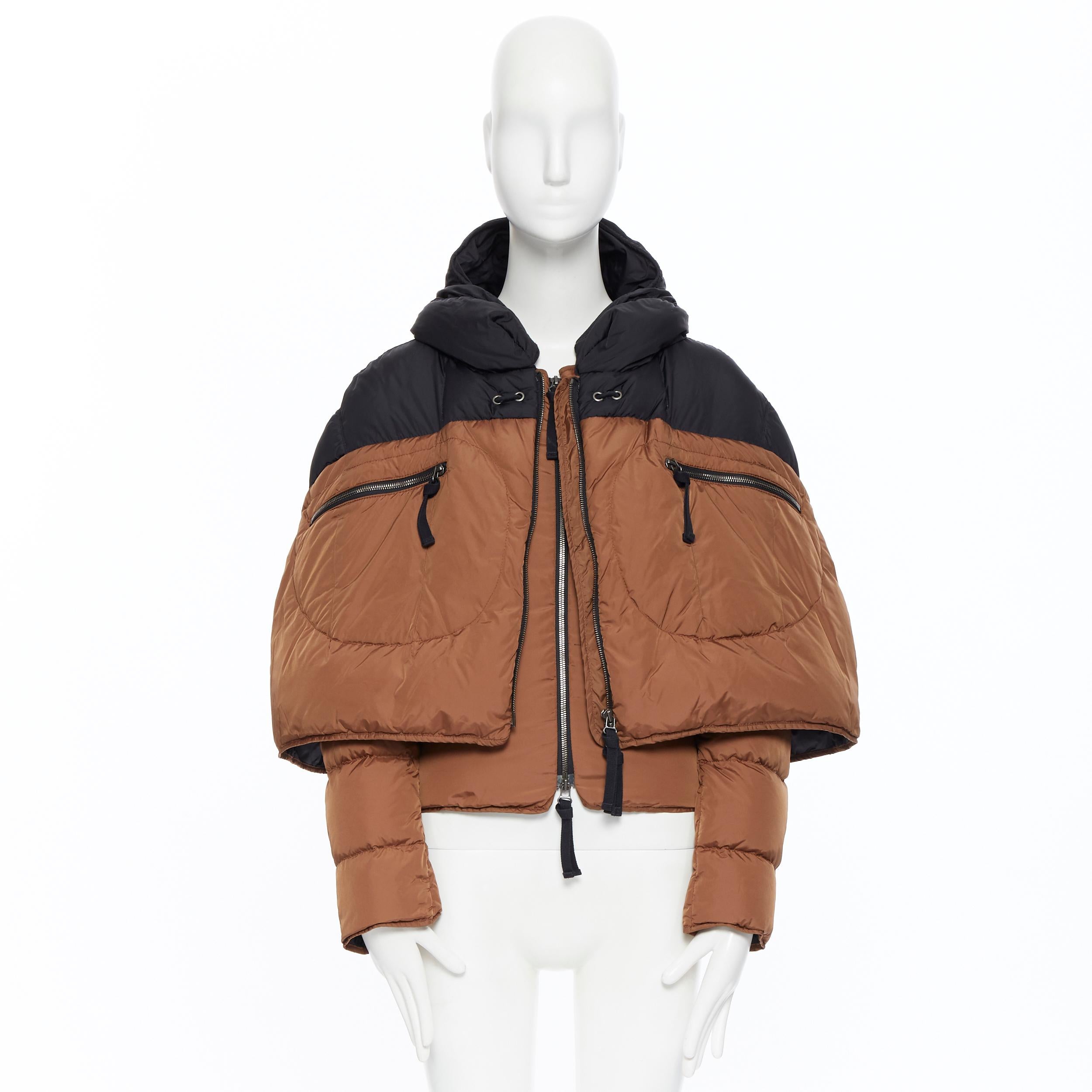 MARNI AW11 brown black colorblocked cape layered down feather padded jacket IT38
Brand: Marni
Model Name / Style: Down jacket
Material: Polyamide
Color: Brown and black
Pattern: Solid
Closure: Zip
Extra Detail: Cape layered. Hooded. Dual zipper