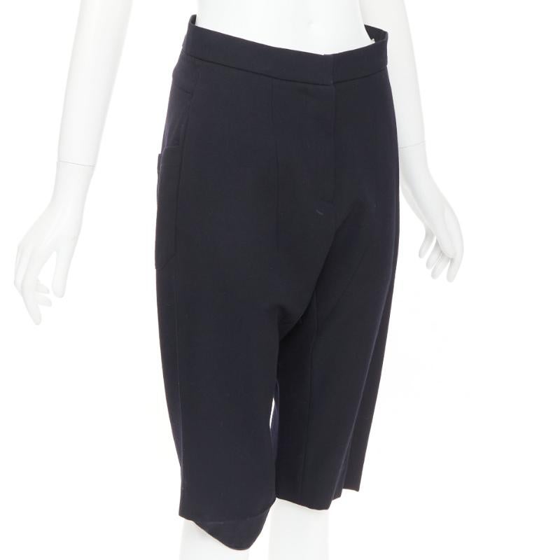 MARNI black 100% virgin wool drop crotch harem knee shorts IT38 XS
Reference: NKLL/A00599
Brand: Marni
Material: Virgin Wool
Color: Black
Pattern: Solid
Closure: Zip Fly
Made in: Italy

CONDITION:
Condition: Fair, this item was pre-owned and is in