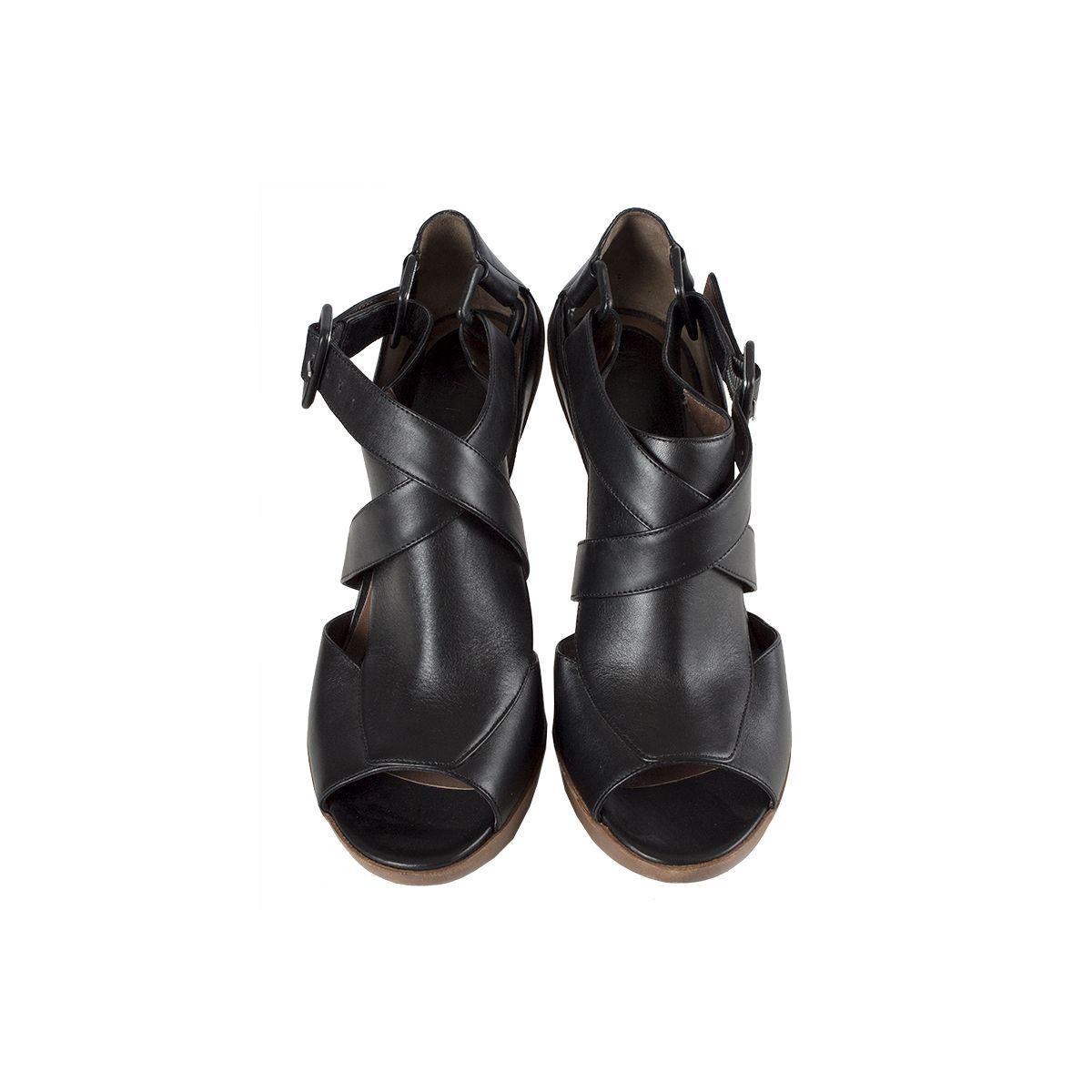 100% authentic Marni platform sandals in black leather with brown distressed leather. Rubber soles. Have been worn and are in excellent condition.

Imprinted Size	39
Shoe Size	39
Inside Sole	26cm (10.1in)
Width	8cm (3.1in)
Heel	13cm
