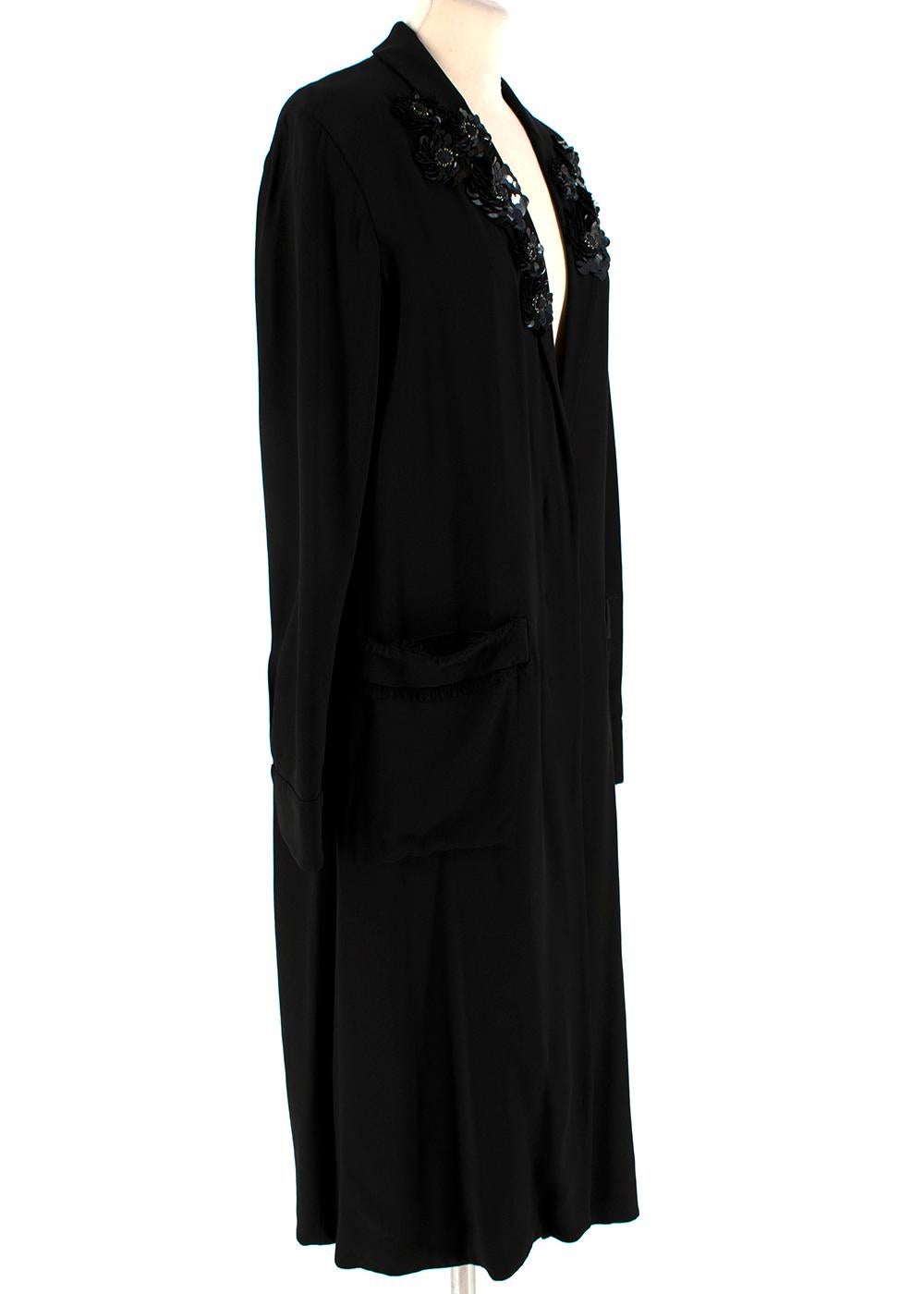 Marni Black Crepe Sequin Embellished Lightweight Coat

-Made of a soft lightweight crepe 
-Gorgeous flower like sequin embellishments to the shoulders 
-Classic elegant cut 
-Frayed details to the pockets 
-2 pockets to the front 
-Concealed button