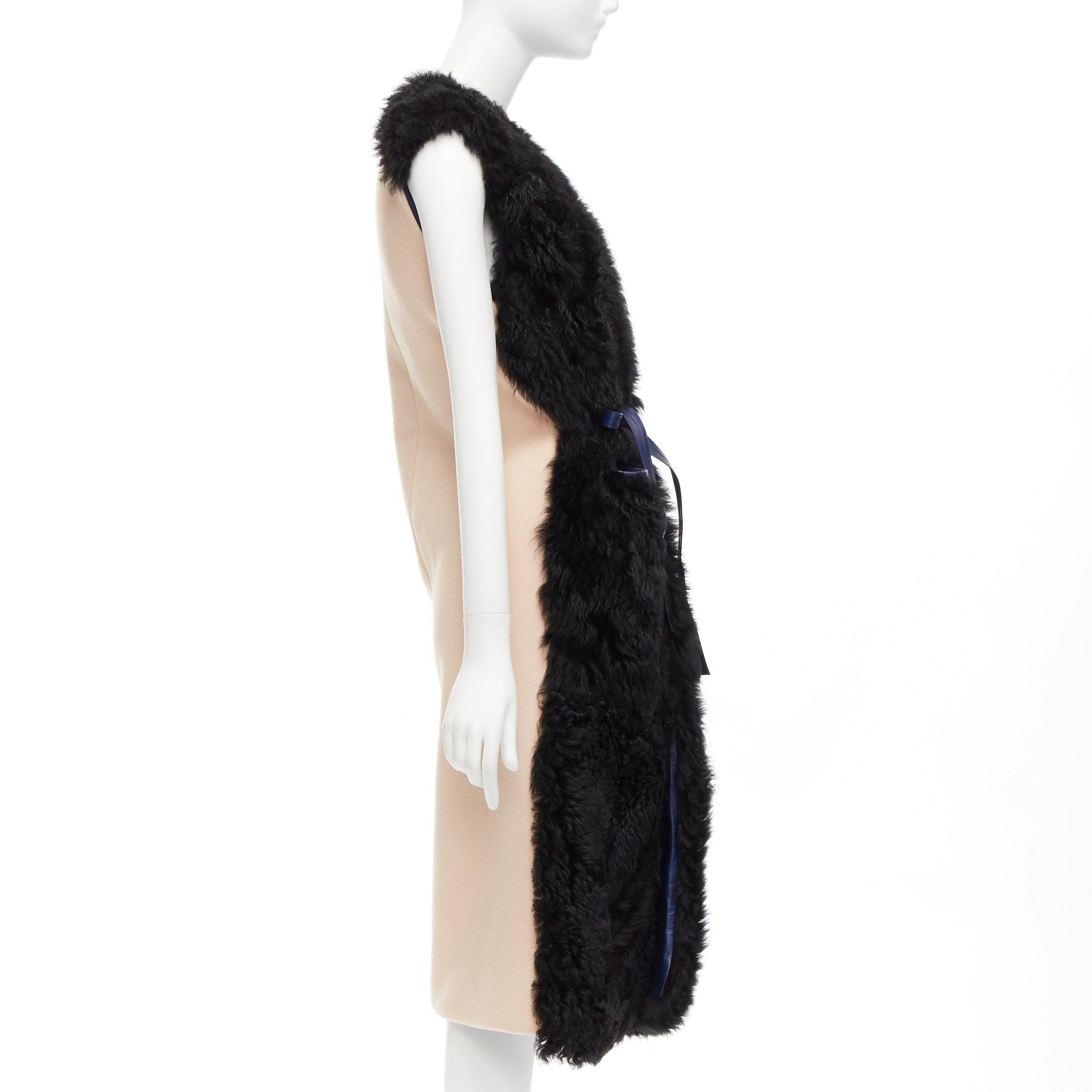 MARNI black lamb shearling fur blue leather belted belt IT38 XS
Reference: CELG/A00237
Brand: Marni
Material: Lambskin Leather, Virgin Wool, Cashmere
Color: Black, Blue
Pattern: Solid
Closure: Belt
Lining: Black Fabric
Extra Details: Blue genuine