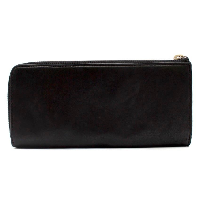 Marni Black Leather Wallet
 
 - Black leather wallet
 - Front logo embroidered
 - Zip fastening
 - Internal two compartments, separated by a coin zipped pocket, 8 card slots and 2 slip pockets
 - Silver-tone hardware
 
 Please note, these items are