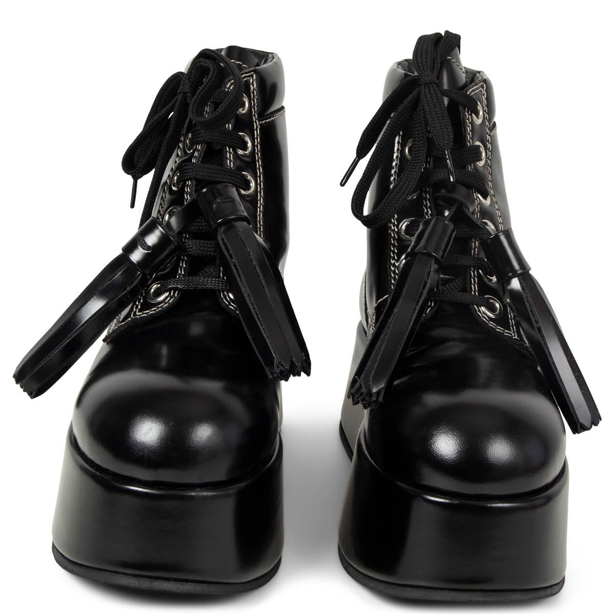 100% authentic Marni lace-up platform ankle boots in black patent leather embellished with tassels, contrasting white stitching and a pull tab at the heel. Have been worn and are in excellent condition. Come with dust bag.

Fall/Winter