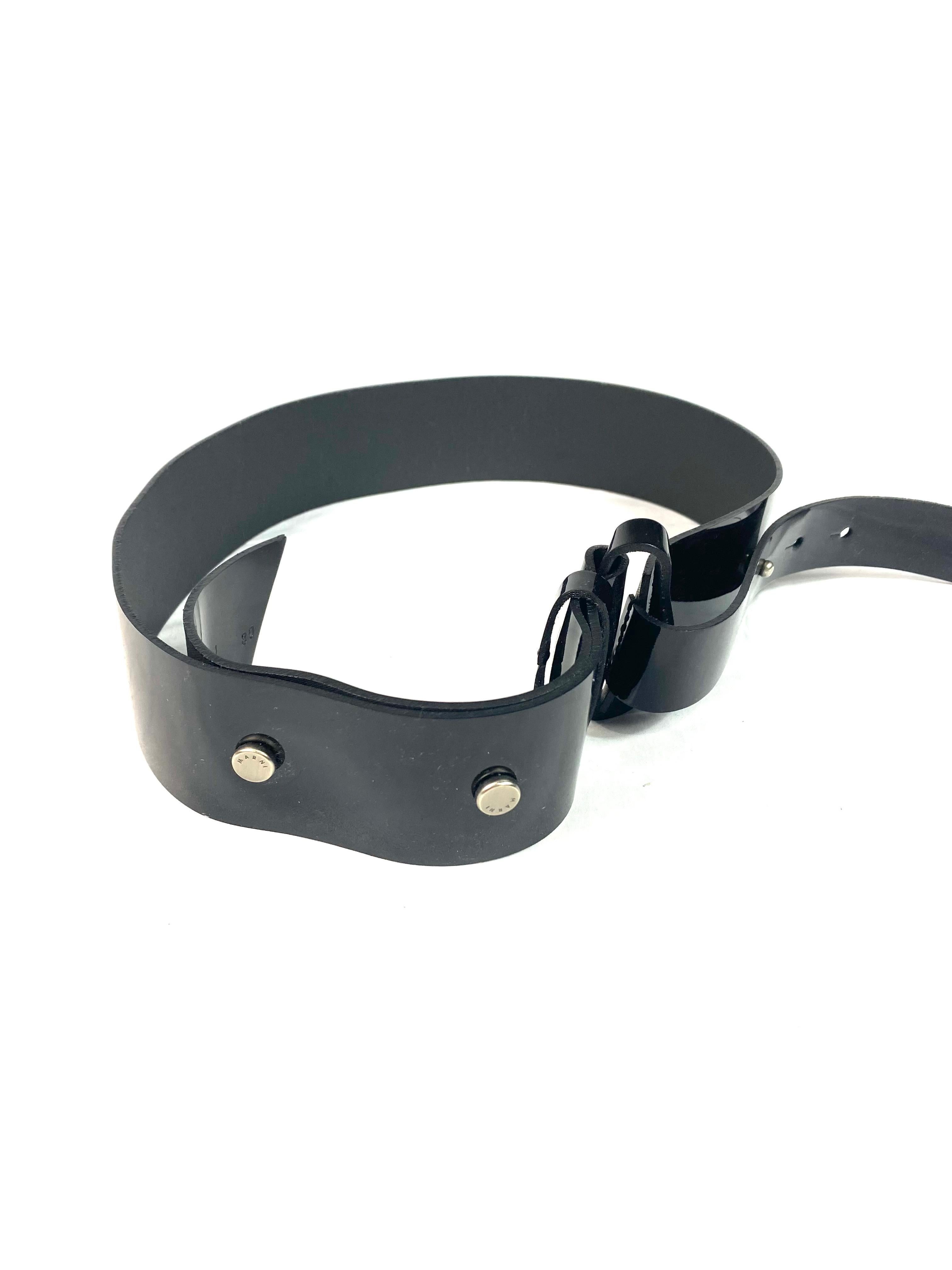 Product details:

The belt features shine finish with silver tone hardware and wide design.
