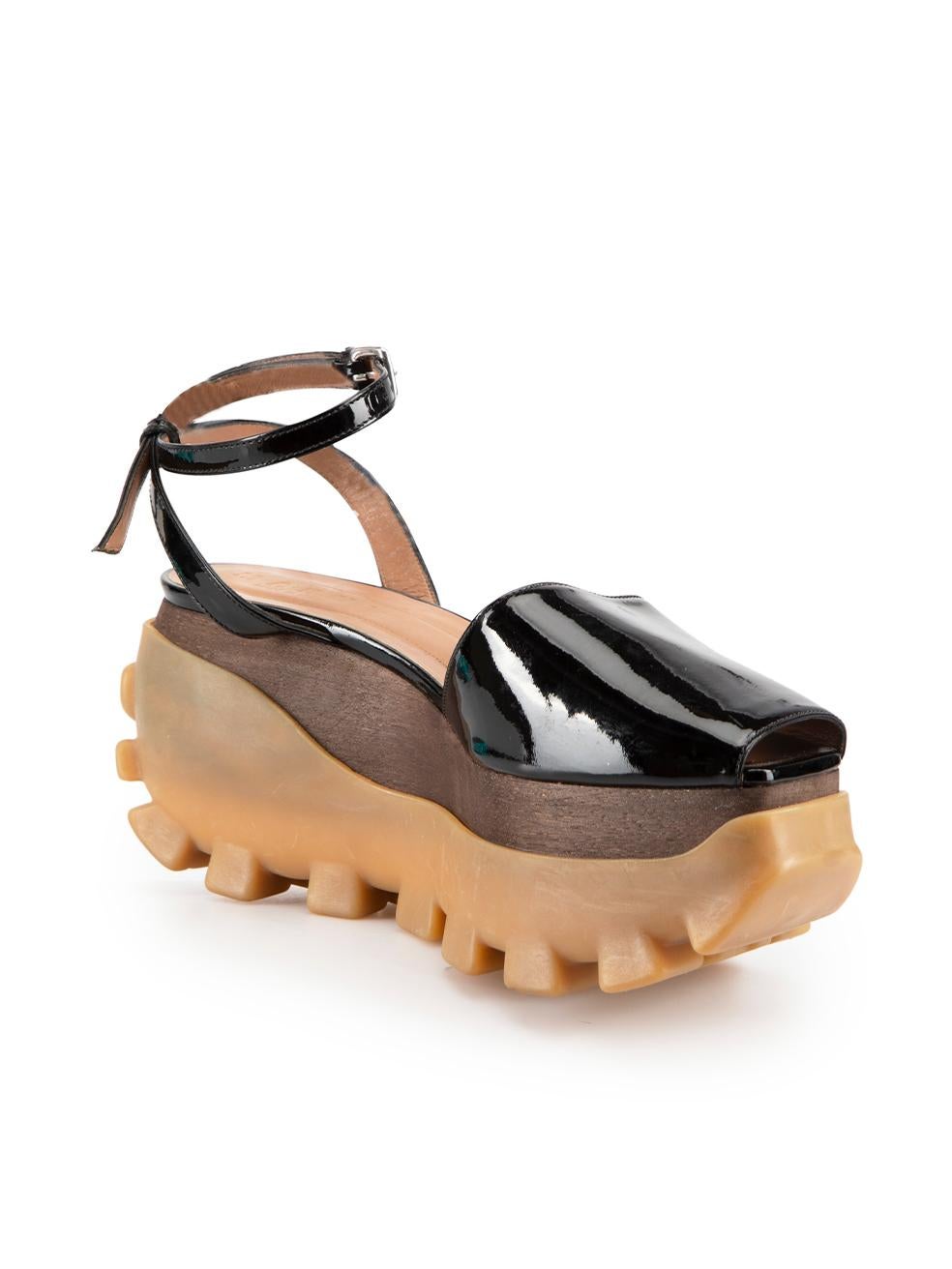 CONDITION is Very good. Minimal wear to shoes is evident. Minimal wear to both shoe rubber platforms with abrasions to the rubber. Both shoe toes also have light scratch marks to the patent leather this used Marni designer resale item.
 