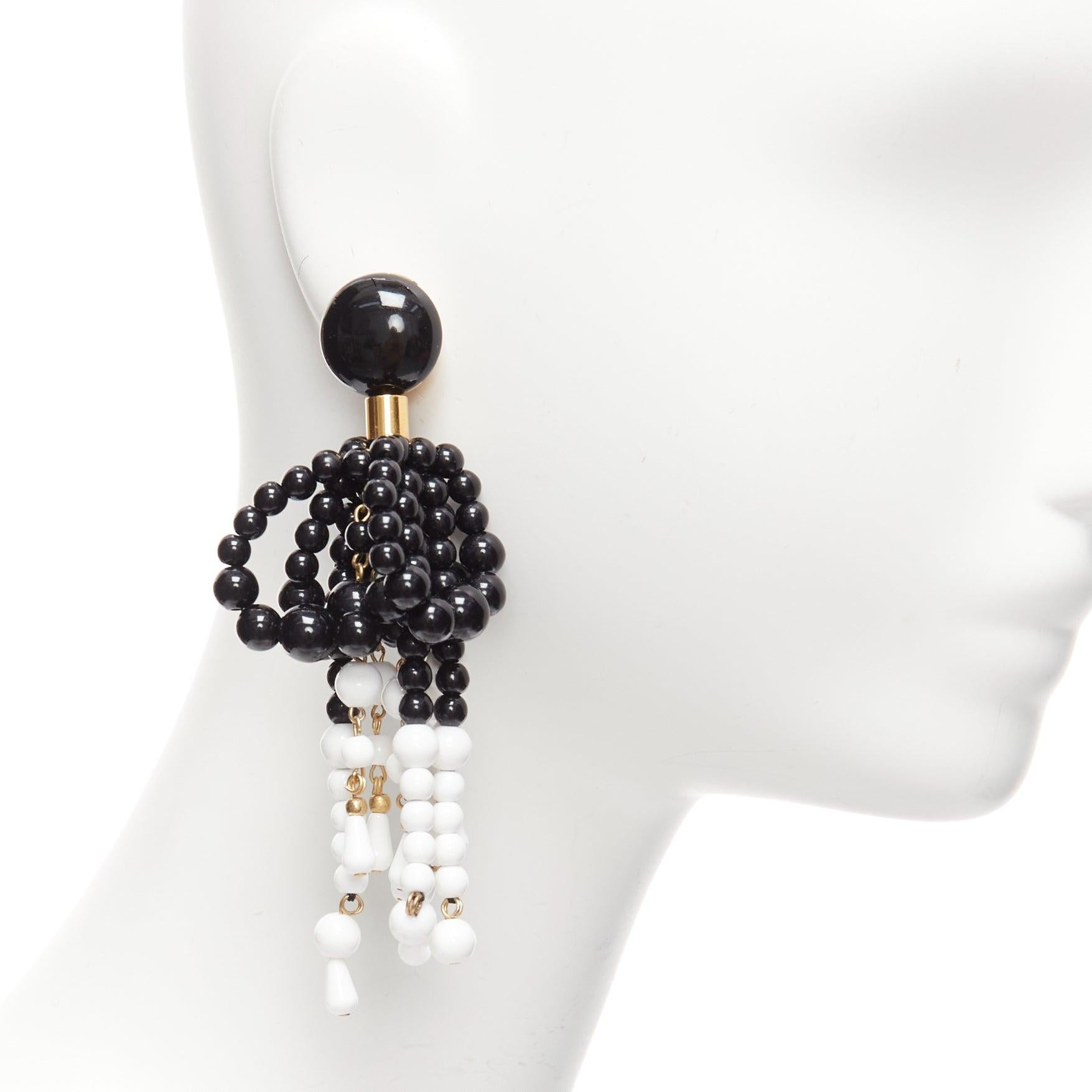 MARNI black white plastic beads drop tassel statement dangling clip on earrings pair
Reference: AAWC/A00911
Brand: Marni
Material: Acrylic, Metal
Color: Black, White
Pattern: Solid
Closure: Clip On
Lining: Gold Metal
Made in: